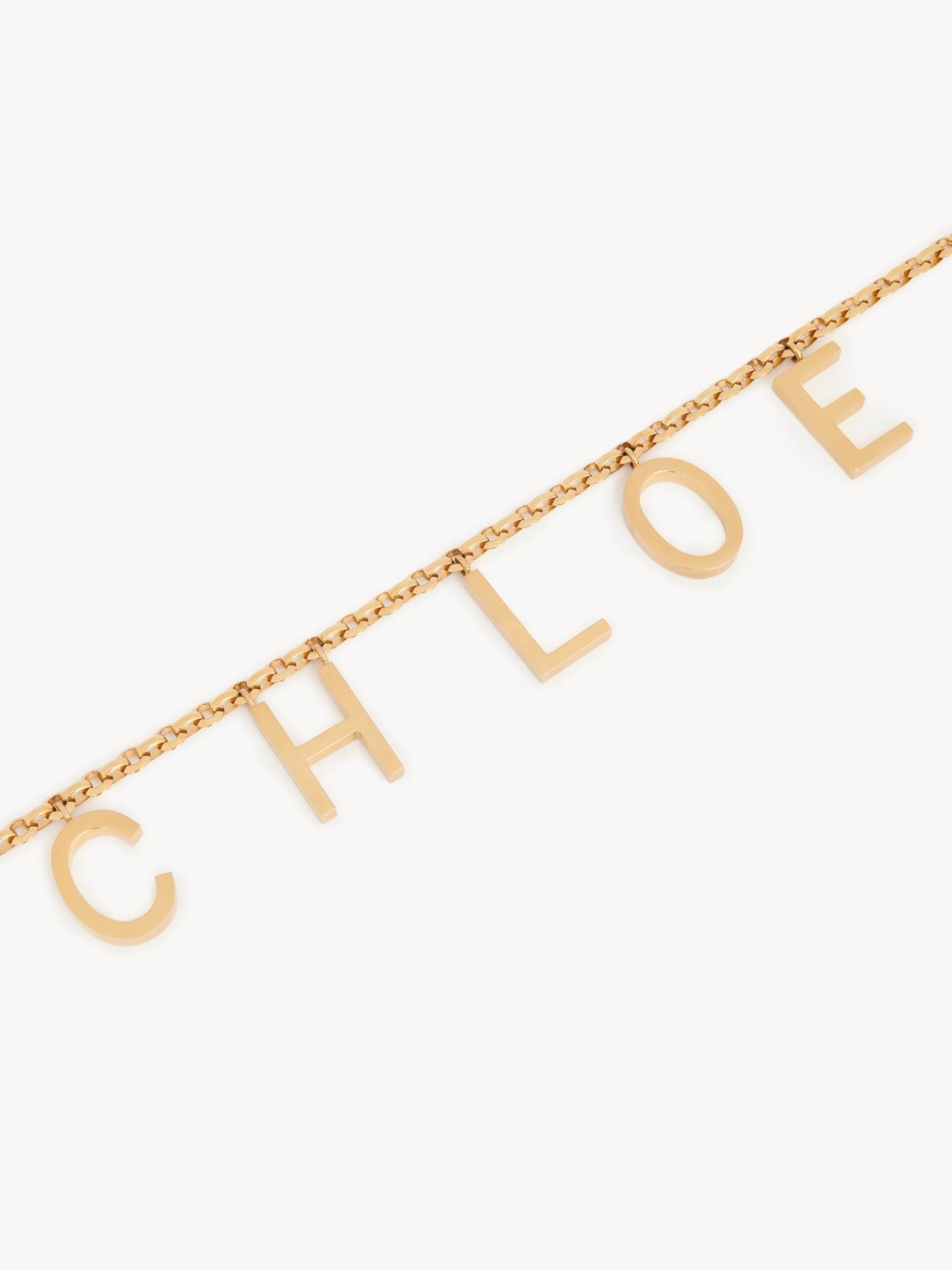 CHLOÉ Metallic Belt With Adjustable Hook Closure And Logo Lettering Charm In Brass Woman In Gold Product Image