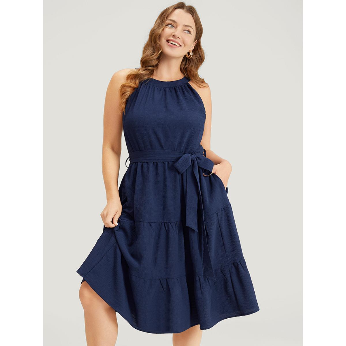 Plus Size Solid Knot Halter Pocket Belted Ruffles Tiered Hem Dress Indigo Women Elegant Gathered Halter neck Sleeveless Curvy Knee Dress BloomChic 12/L Product Image