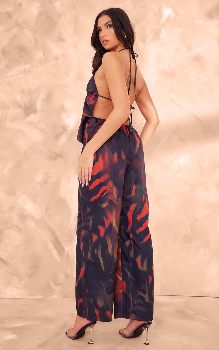 Black Leaf Printed Cowel Detail Halter Neck Jumpsuit Product Image