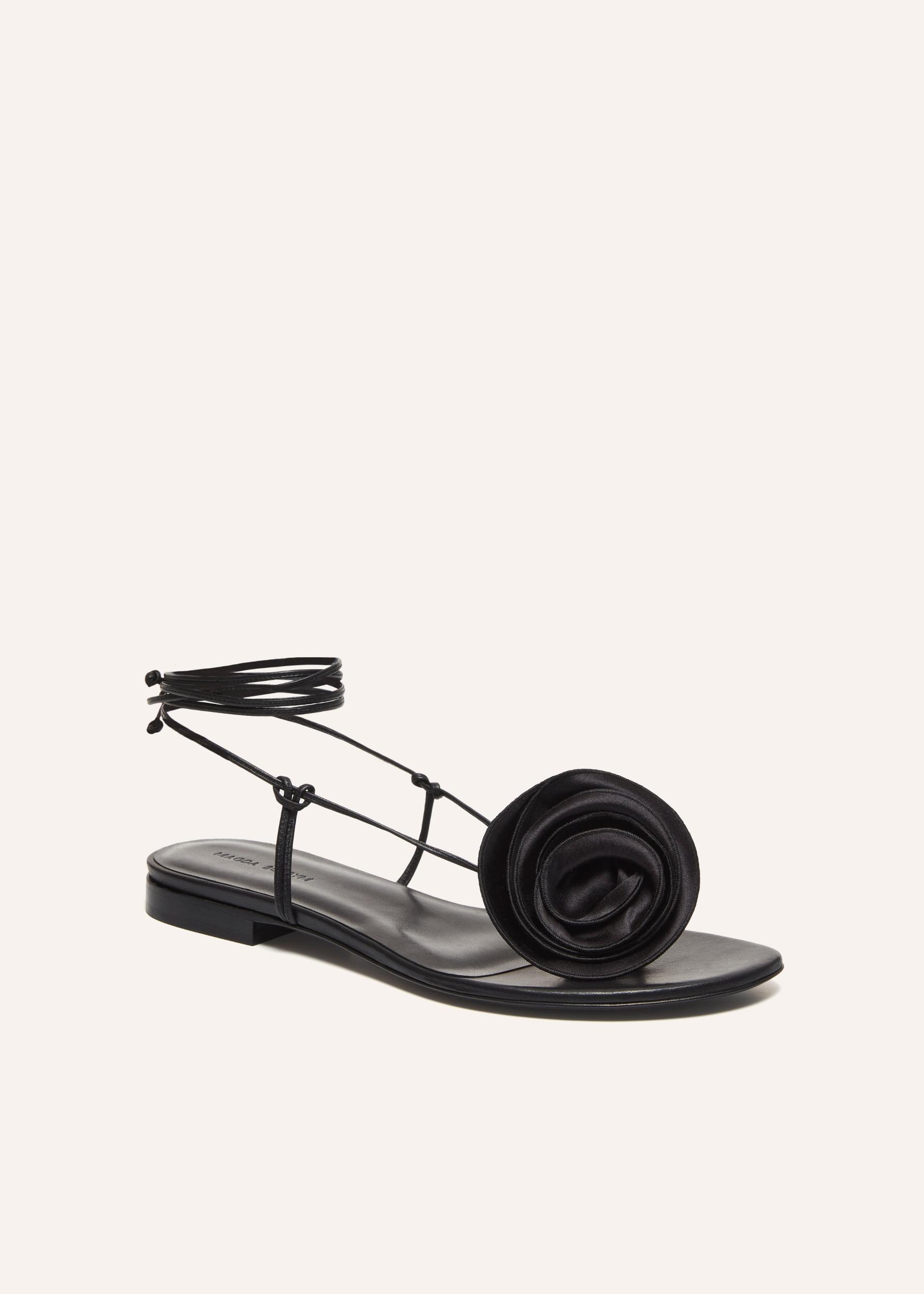 Wrap around flat flower sandals in black satin Product Image