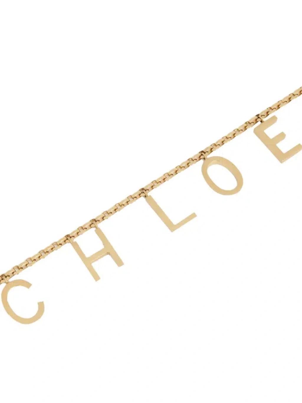 CHLOÉ Metallic Belt With Adjustable Hook Closure And Logo Lettering Charm In Brass Woman In Gold Product Image