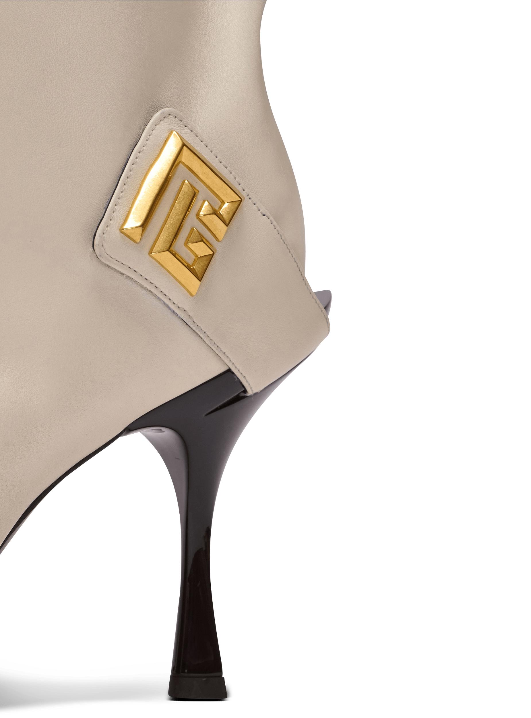 Twist heeled leather boots Product Image