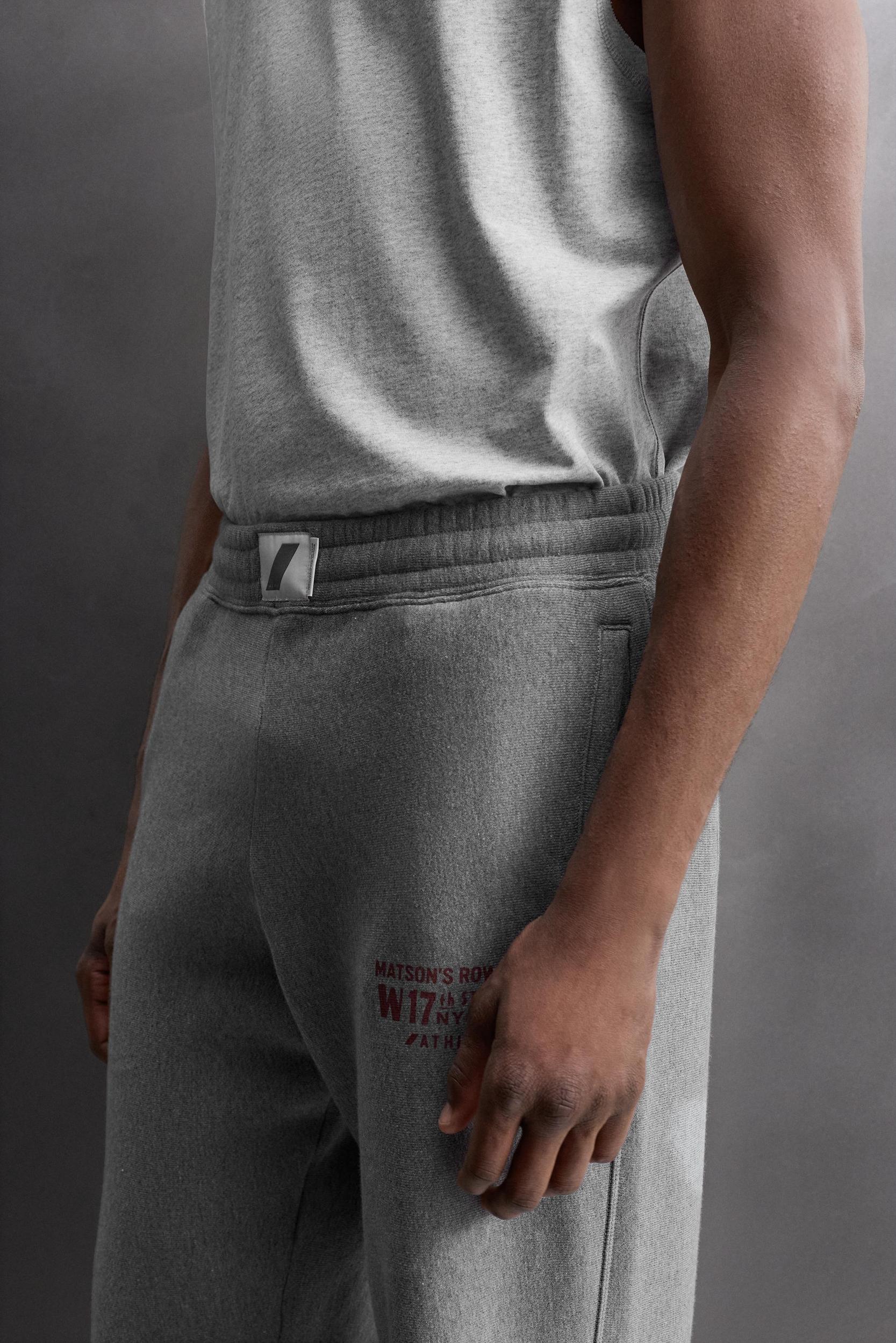 JOGGING PANTS WITH PRINTED TEXT Product Image