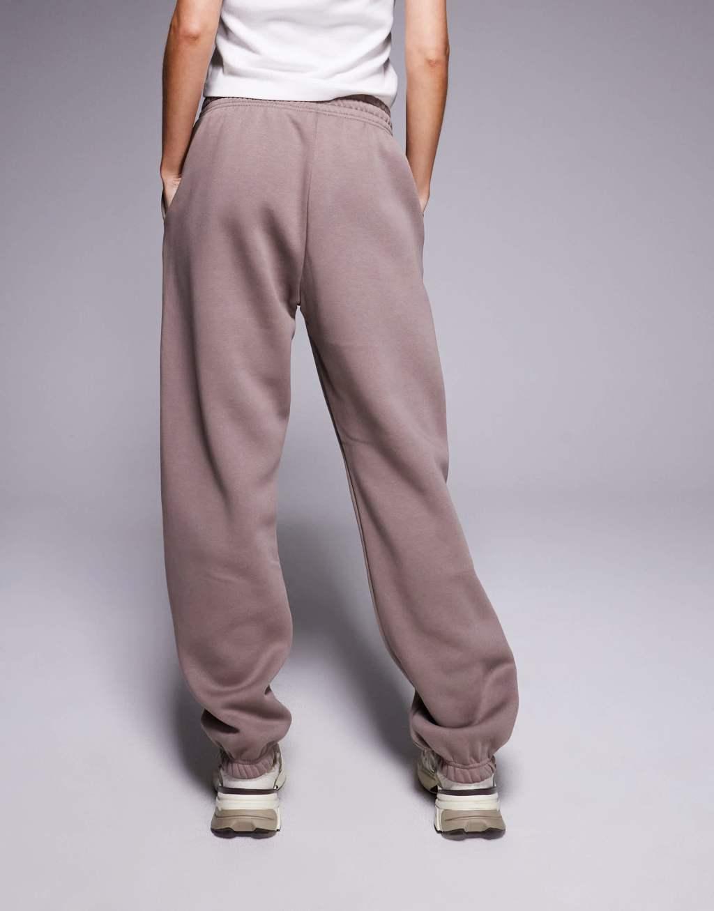 Nike Phoenix Fleece tapered sweatpants in brown Product Image