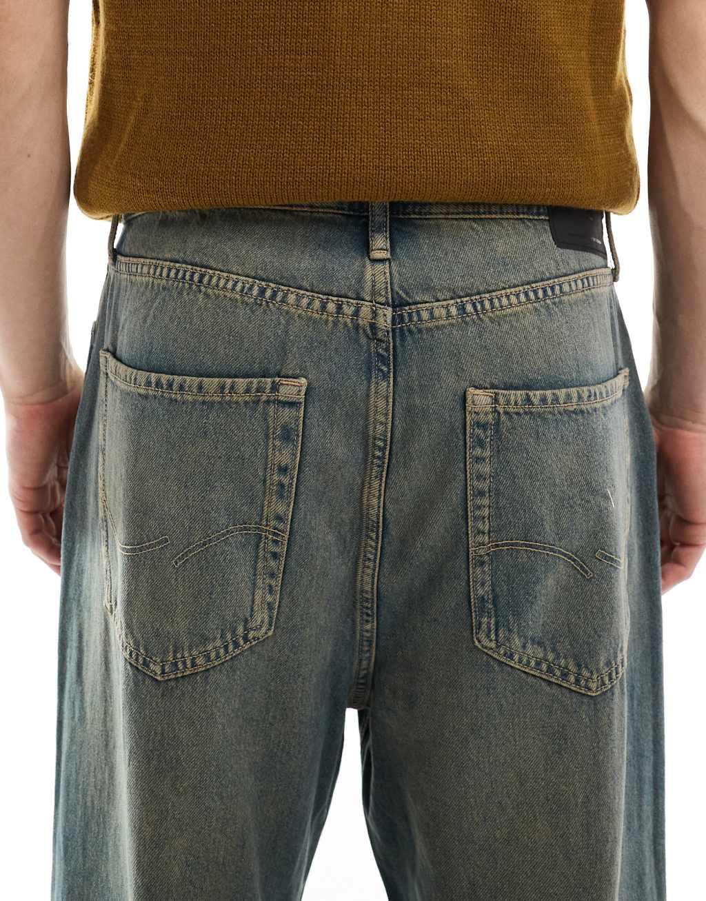 Jack & Jones ron skater jeans with brown cast wash in black Product Image