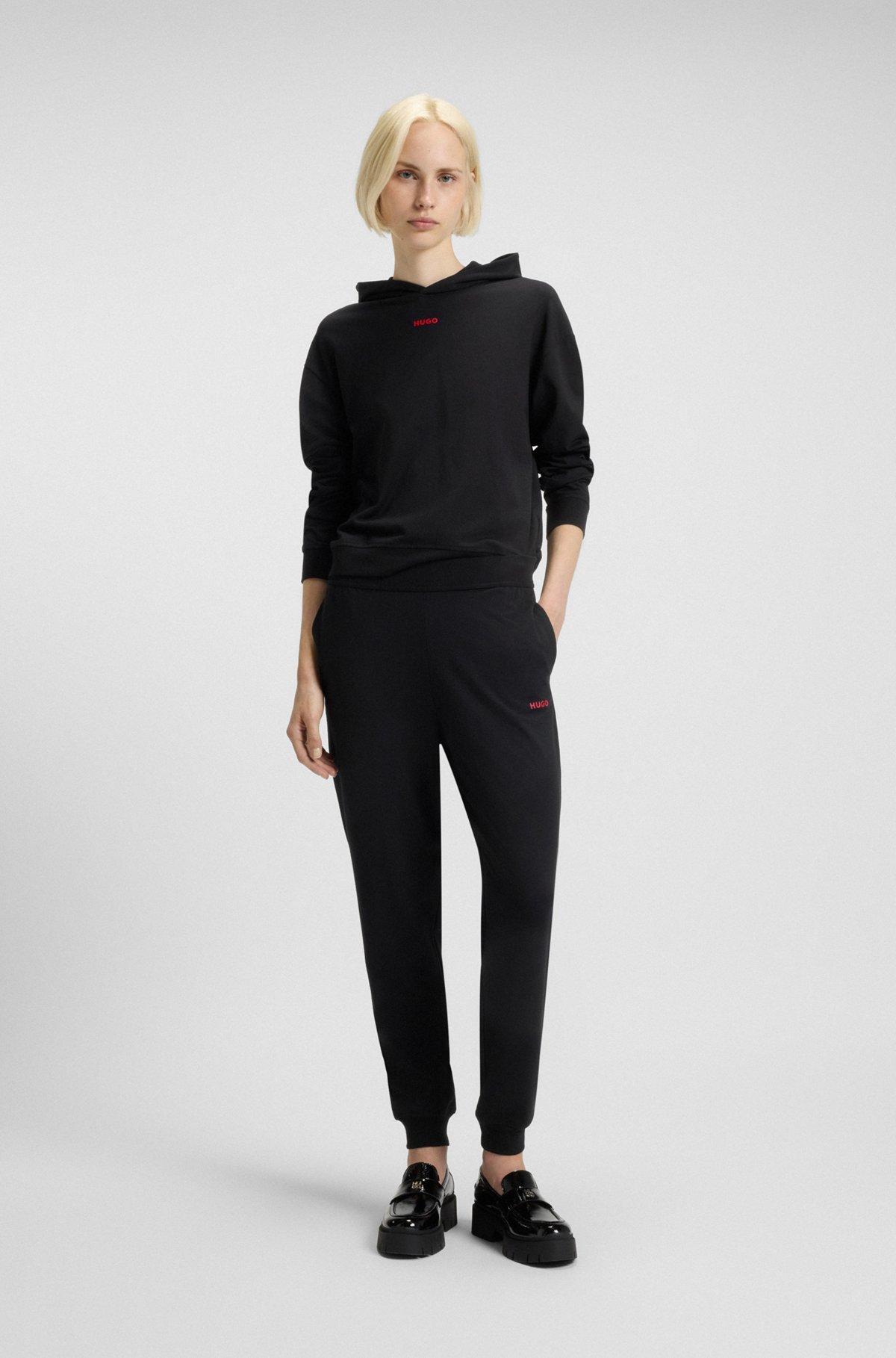 Relaxed-fit tracksuit bottoms with printed logo Product Image