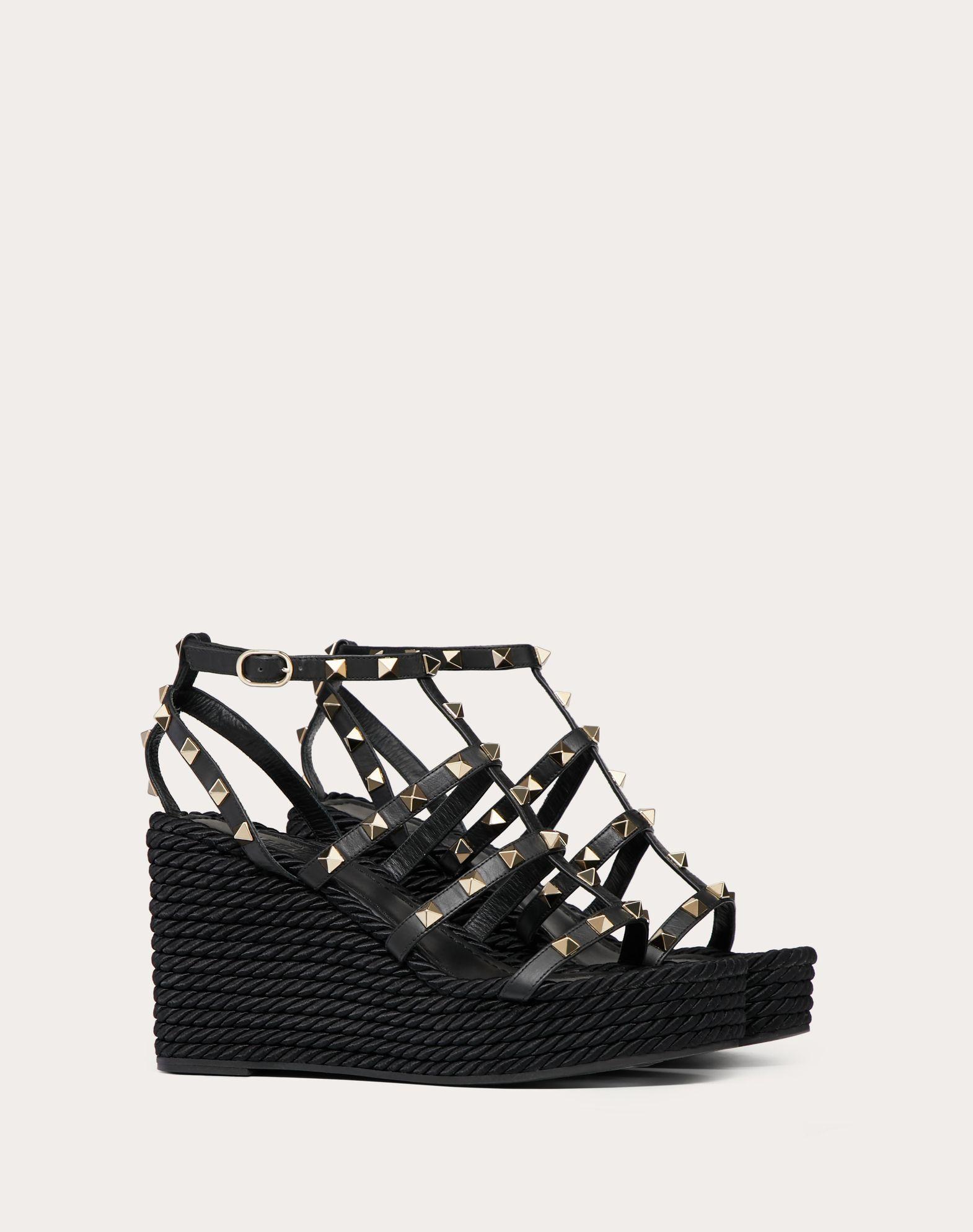 ROCKSTUD ANKLE STRAP WEDGE SANDAL IN CALFSKIN LEATHER 95 MM Product Image