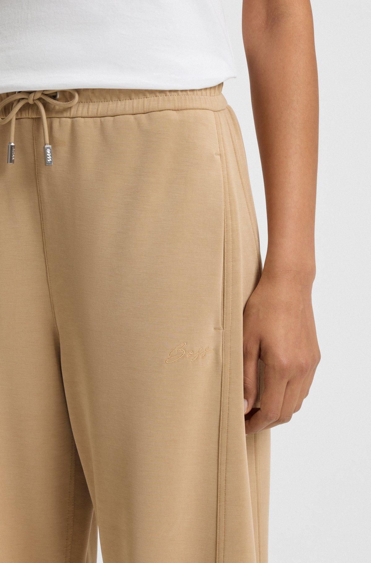 Balloon trousers in stretch jersey with embroidered logo Product Image