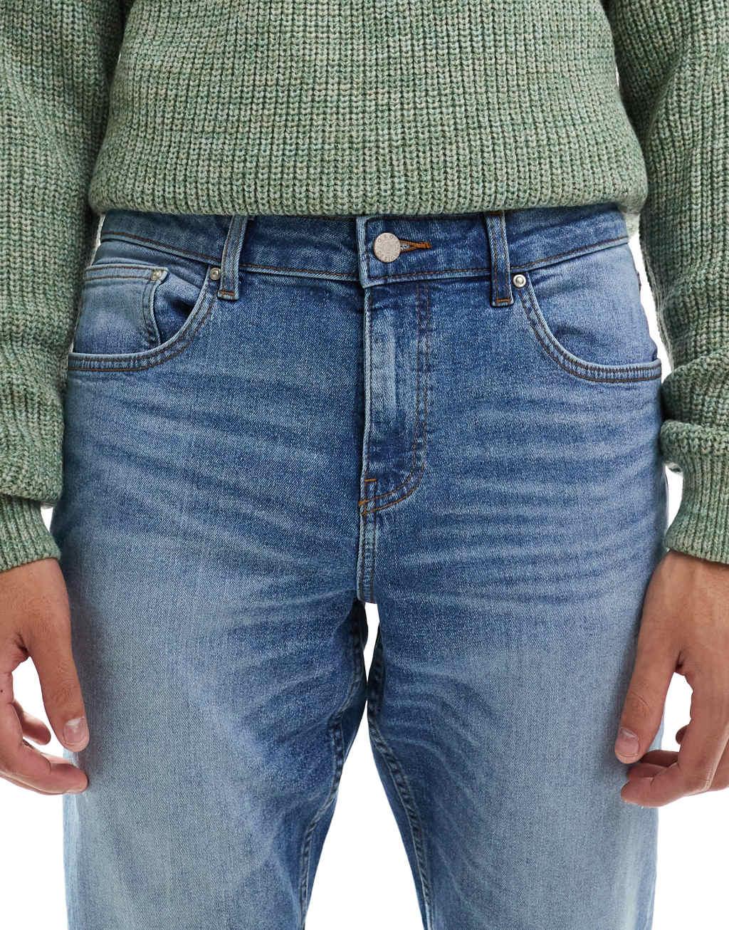 ASOS DESIGN stretch slim jeans in mid wash blue Product Image