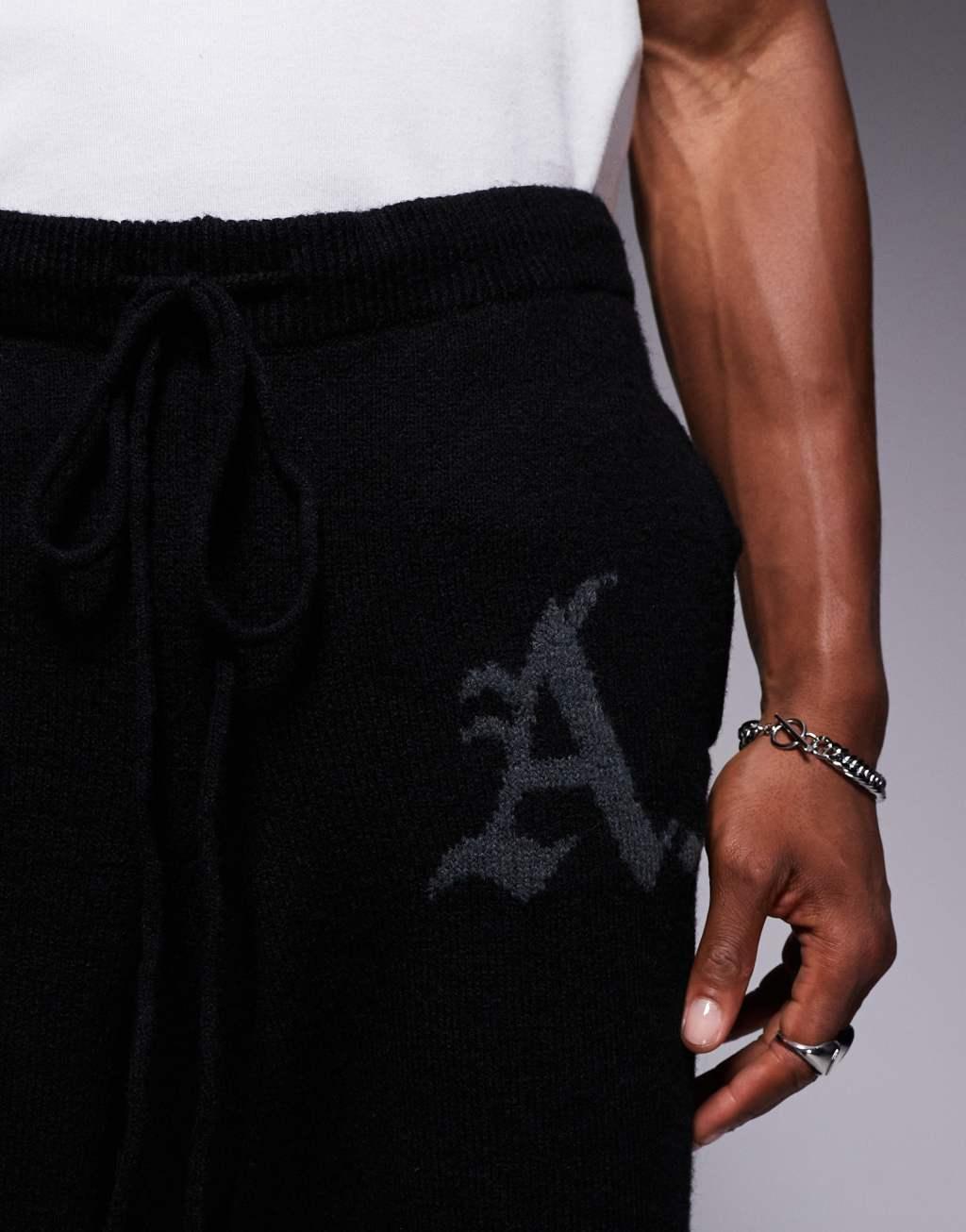 ADPT knitted loose fit sweatpants in black Product Image