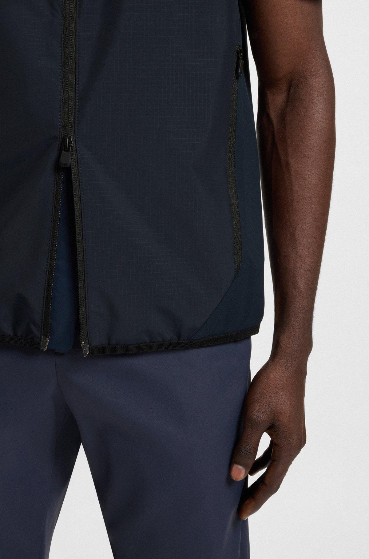 Water-repellent golf vest with decorative reflective details Product Image