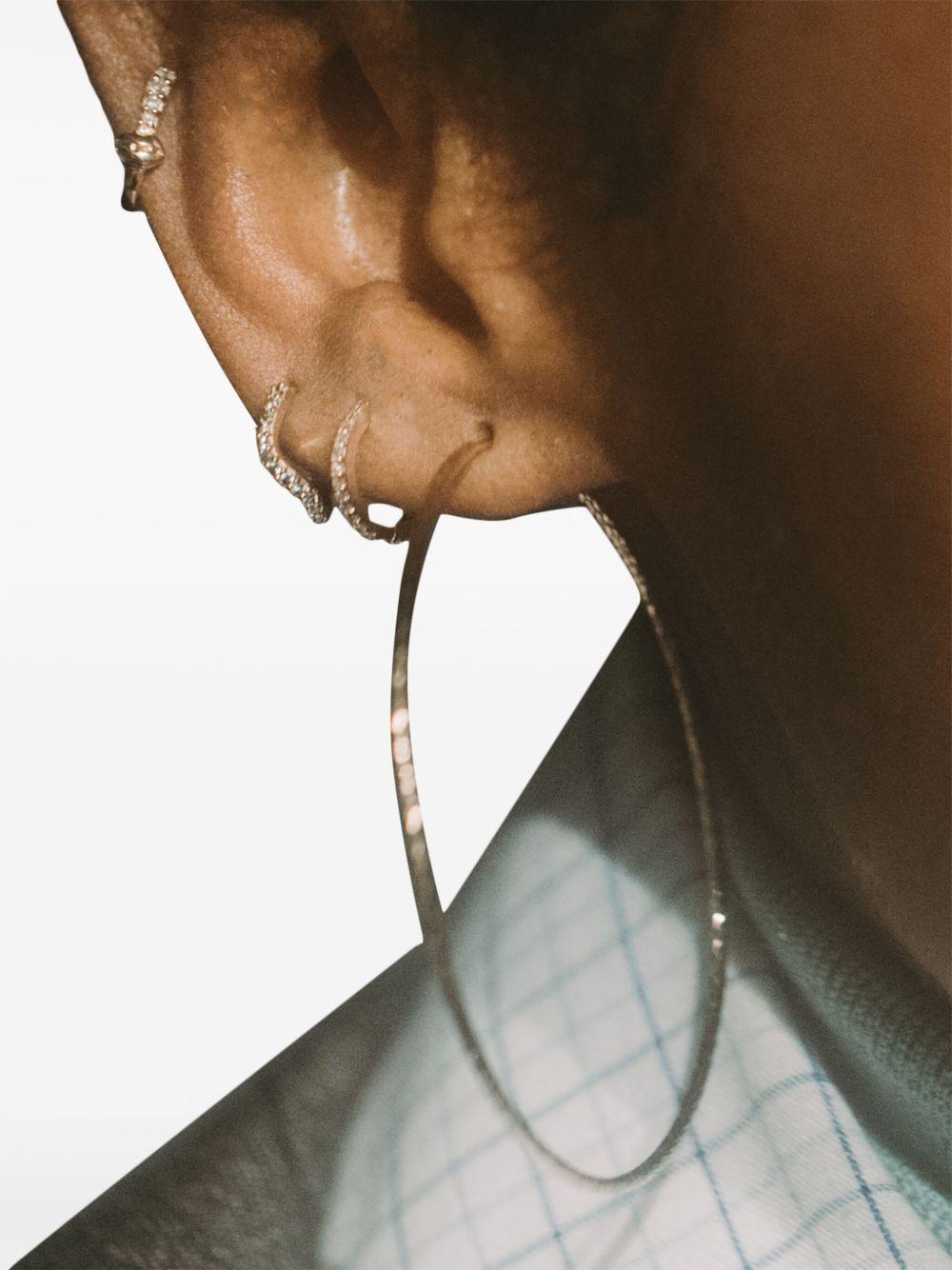 14kt gold Wave diamond huggie earring Product Image