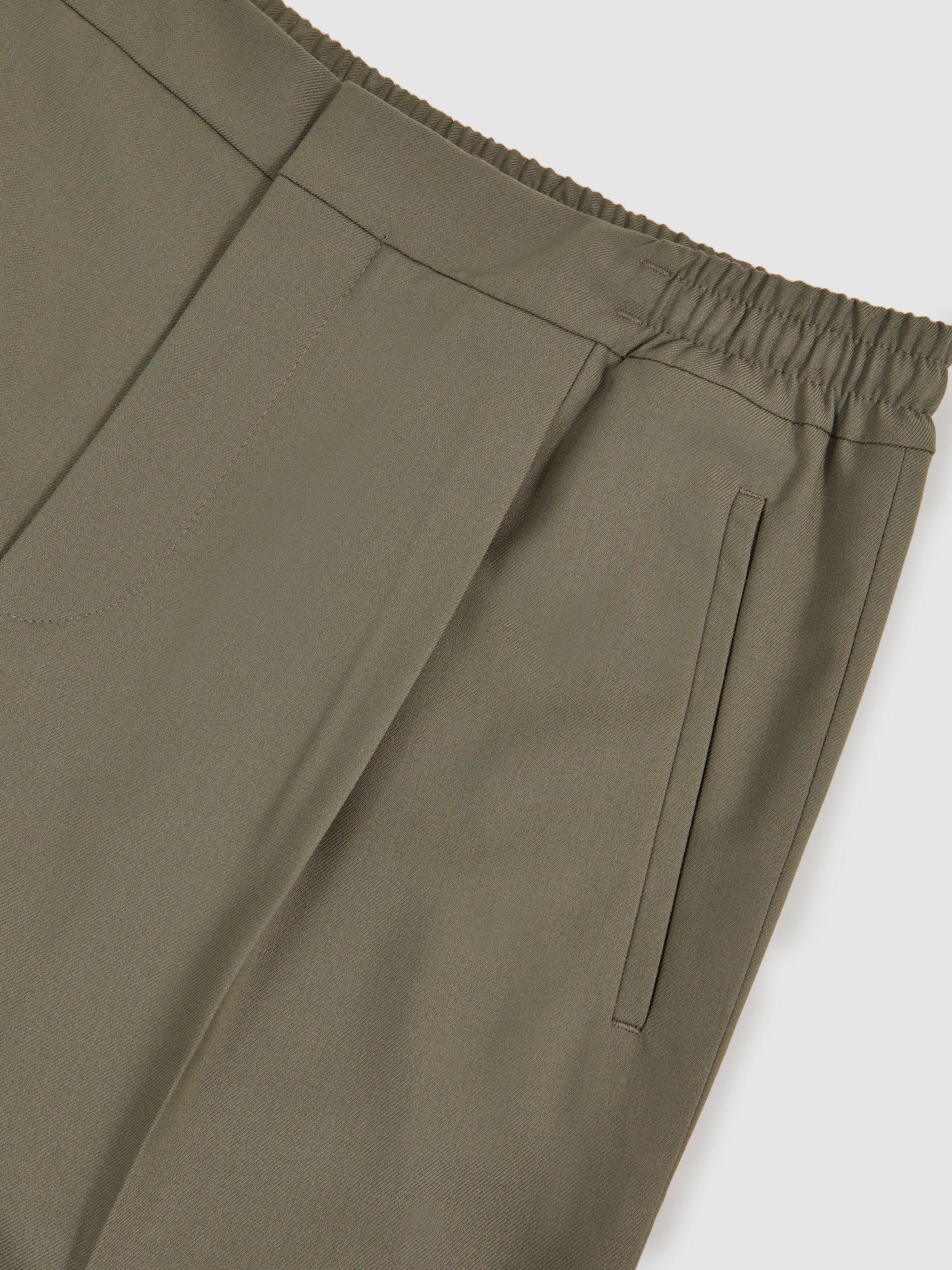 Relaxed-Fit Pleated Tapered Trousers in Sage Product Image