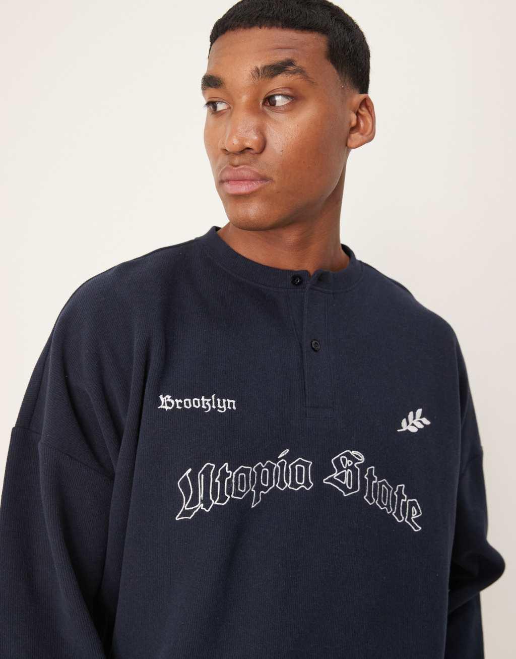 ASOS DESIGN super oversized cropped lightweight sweater with henley neck and print in navy Product Image