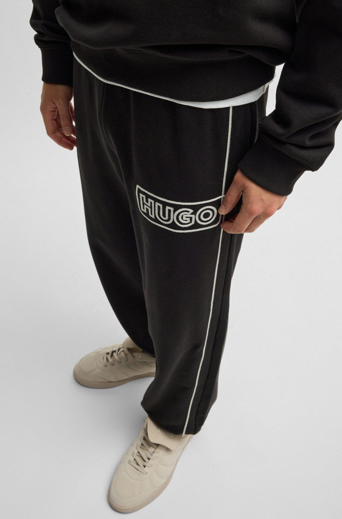 Cotton-terry tracksuit bottoms with chain-stitch logo Product Image