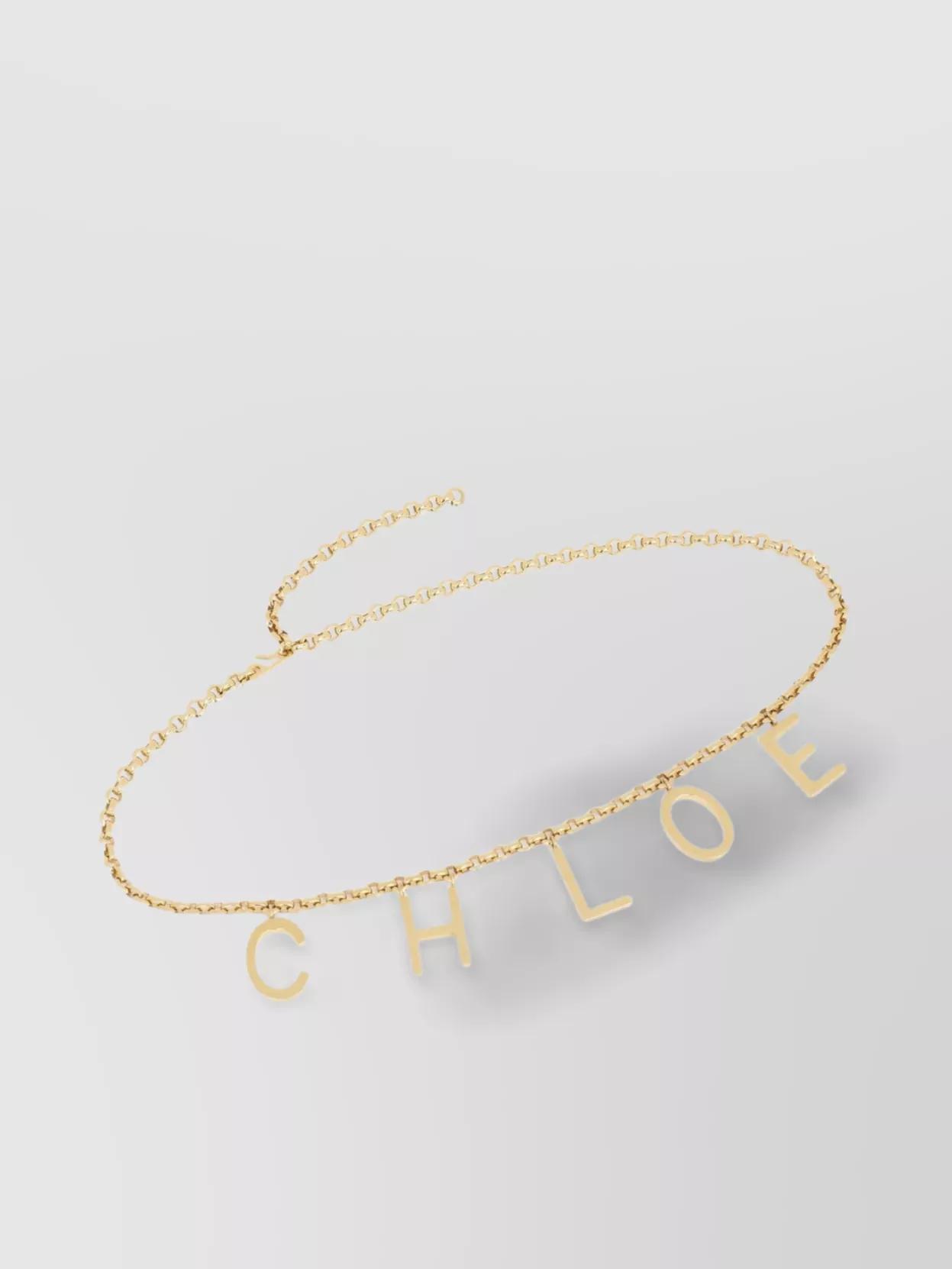CHLOÉ Metallic Belt With Adjustable Hook Closure And Logo Lettering Charm In Brass Woman In Gold Product Image