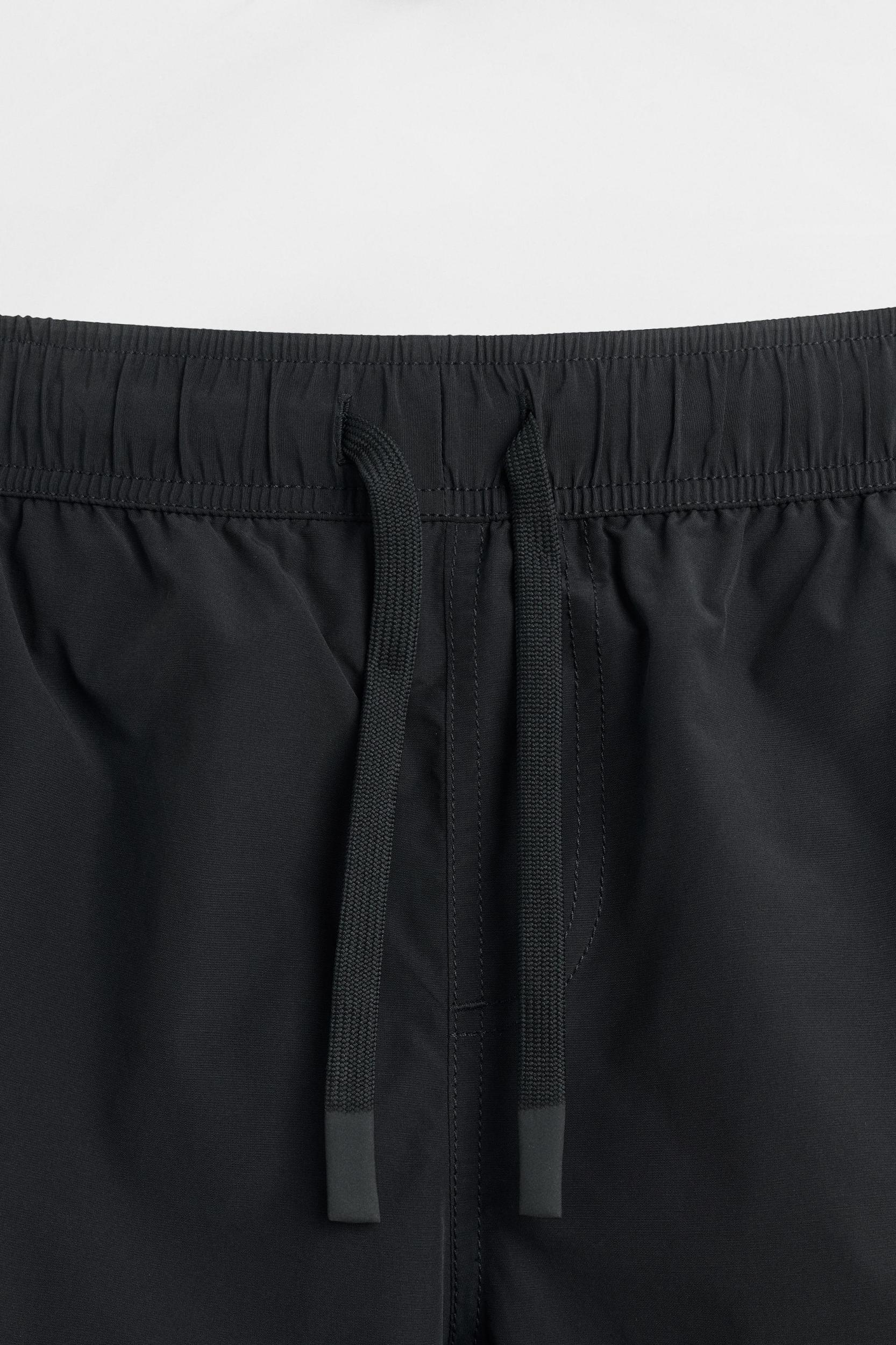 STRIPED LONG SWIM TRUNKS Product Image