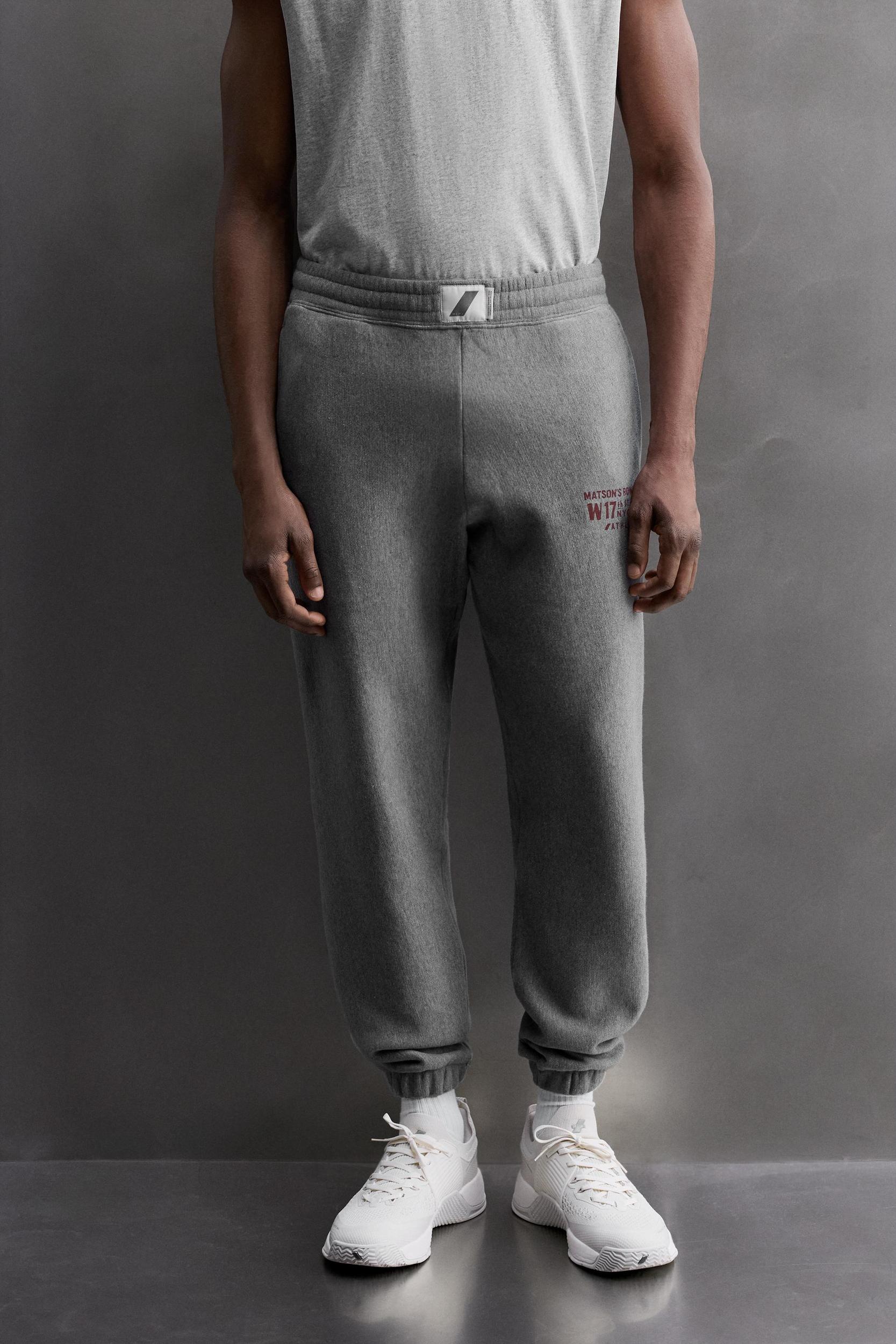 JOGGING PANTS WITH PRINTED TEXT Product Image