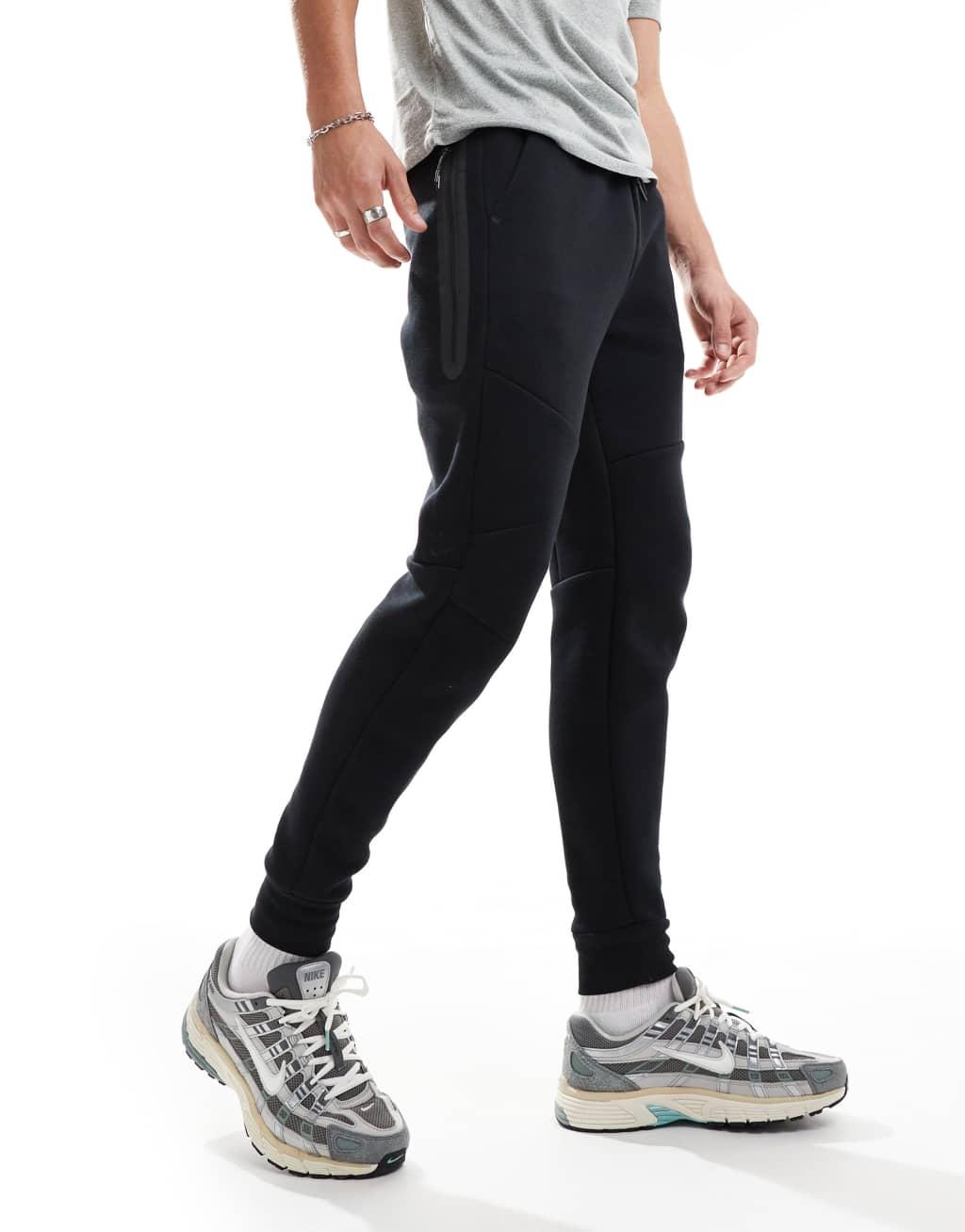 Nike Tech Fleece cuffed joggers in black Product Image