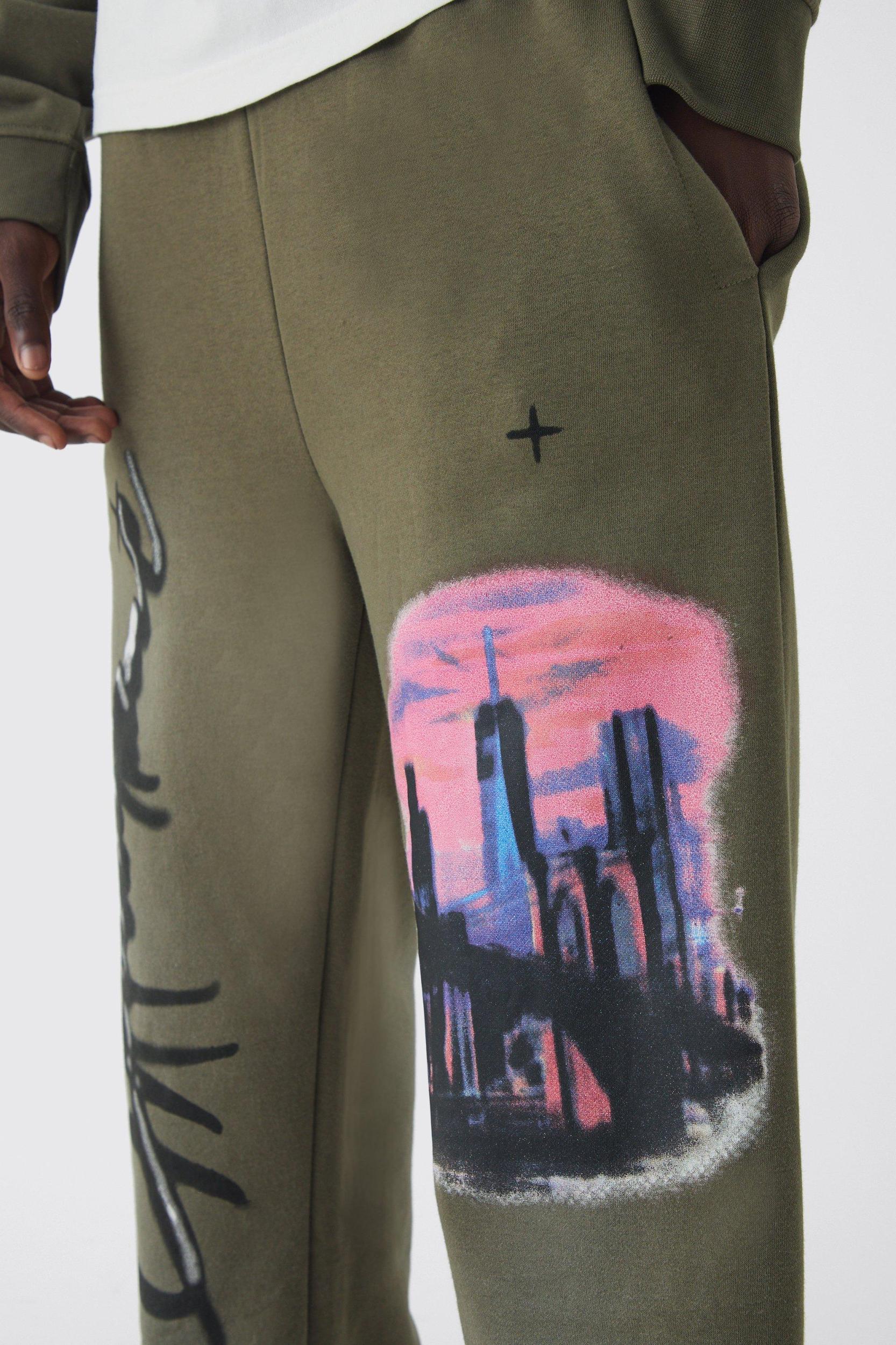 Relaxed Fit Flare Graphic Distressed Brushback Sweatpants | boohooMAN USA Product Image
