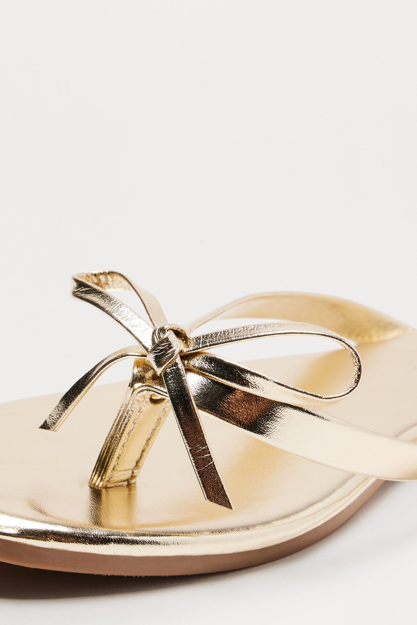 Coral Bow Flip Flops - Gold Female Product Image