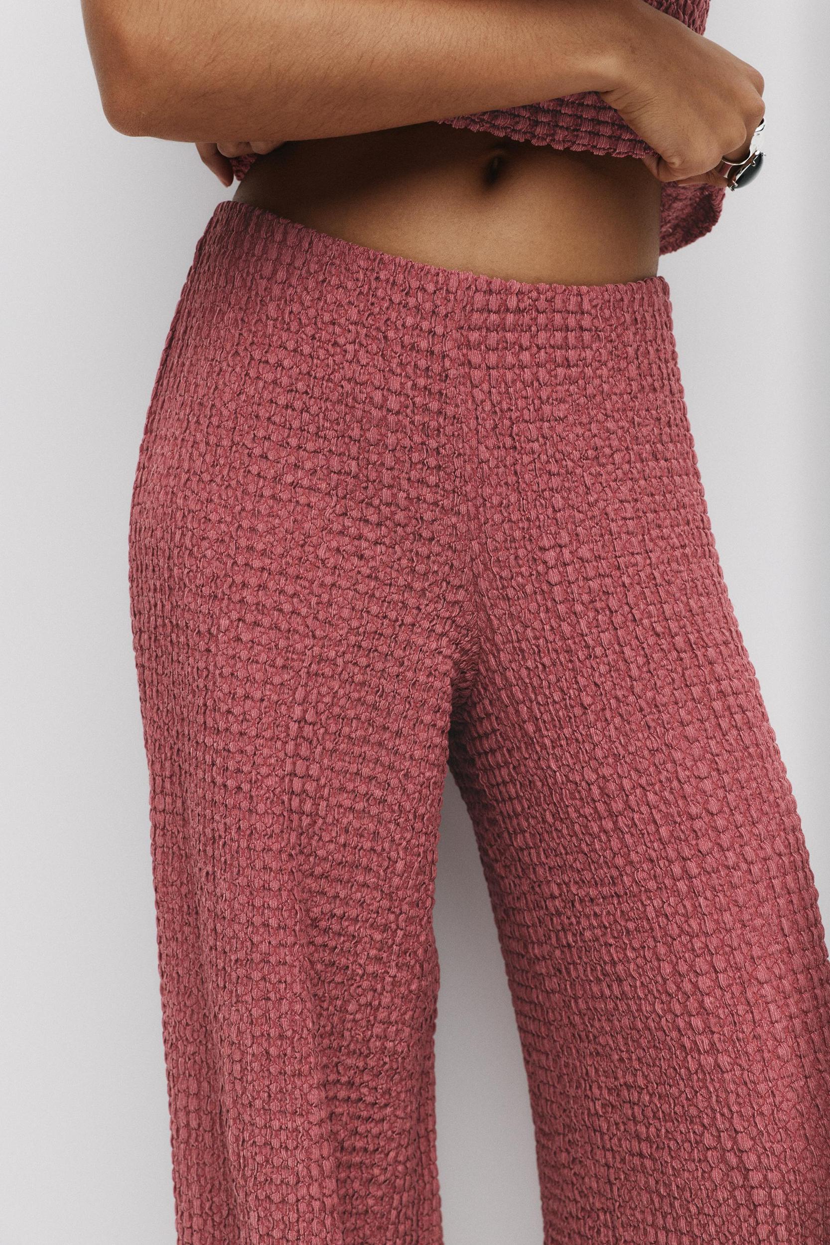 Rustic creased-effect pants Product Image