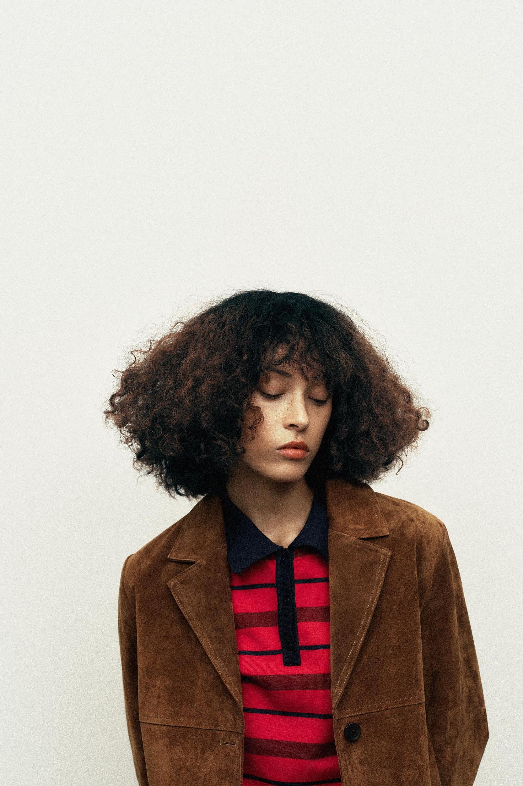 STRIPED KNIT POLO SWEATER Product Image