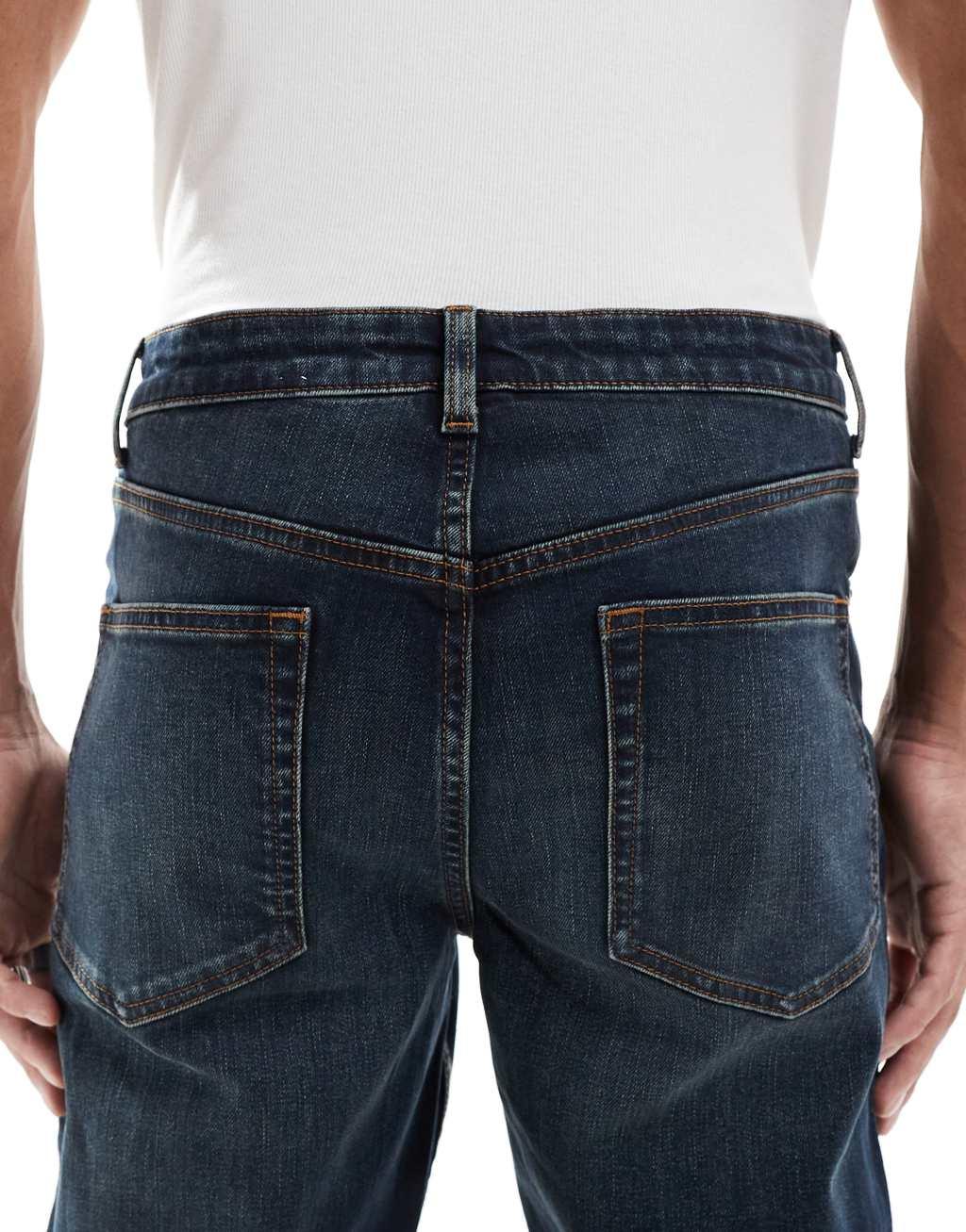 ASOS DESIGN slim jeans with tint in dark wash blue Product Image