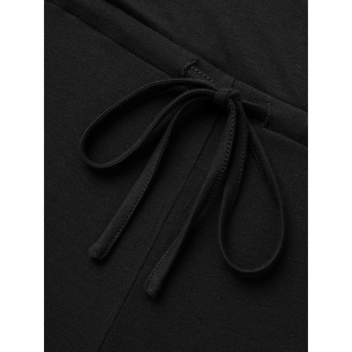 Plus Size Black Solid Overlap Collar Drawstring Jumpsuit Women Elegant Sleeveless Overlap Collar Everyday Loose Jumpsuits BloomChic 14-16/1X Product Image