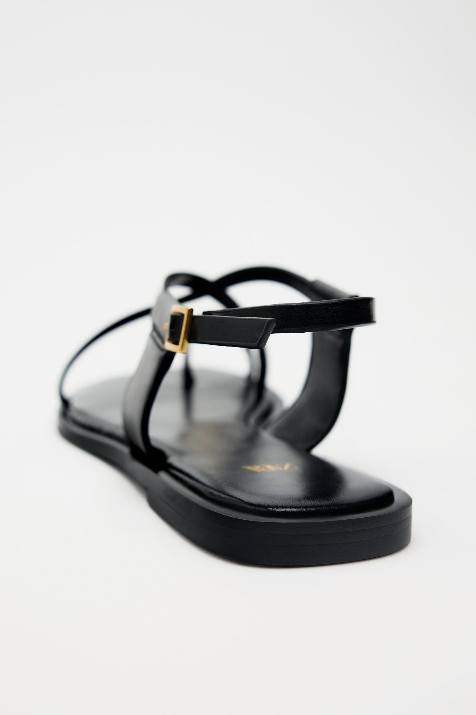 FLAT STRAPPY SANDALS WITH METAL ORNAMENT Product Image
