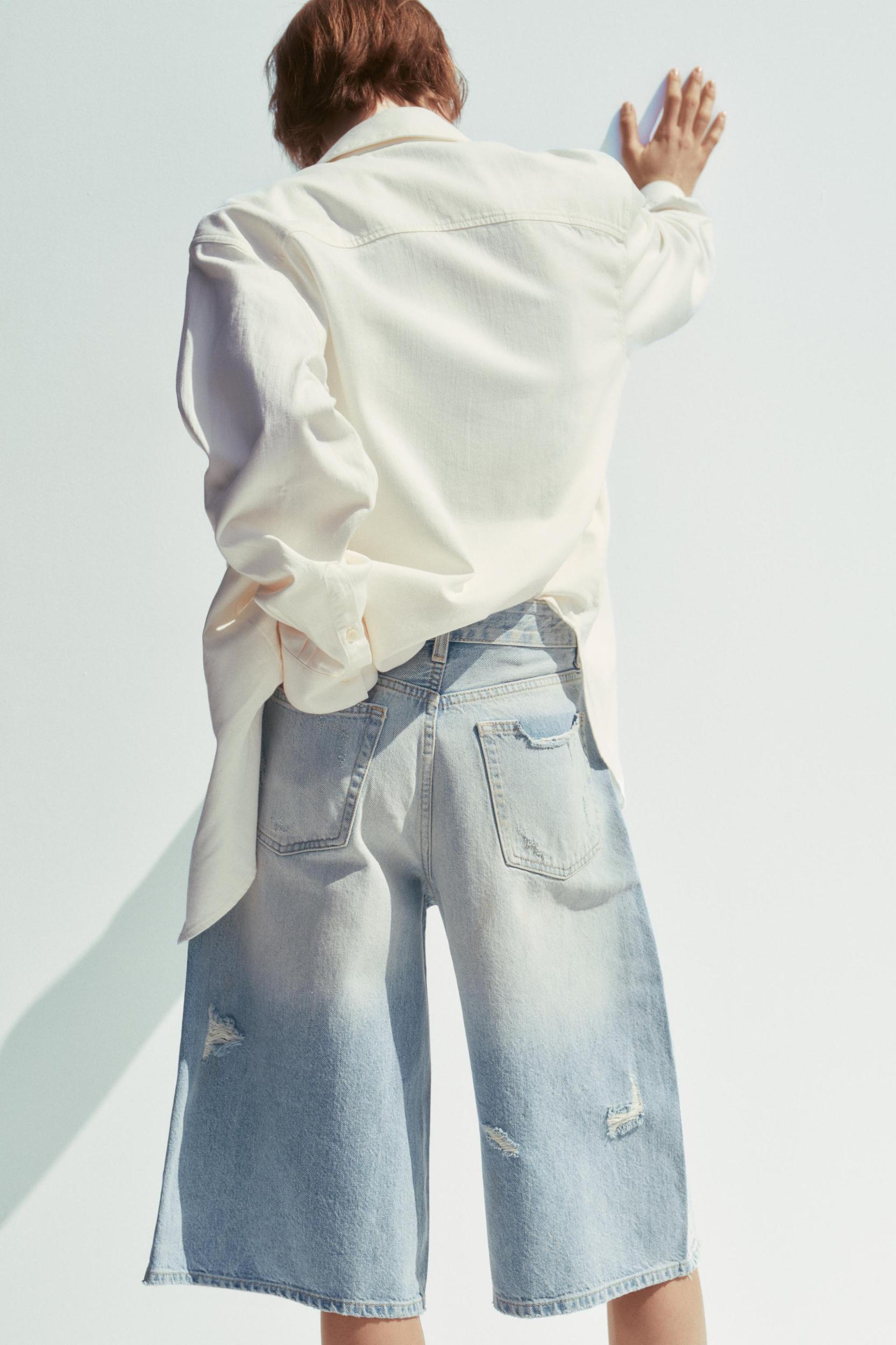 MID-RISE RIPPED DENIM BERMUDA JORTS Product Image