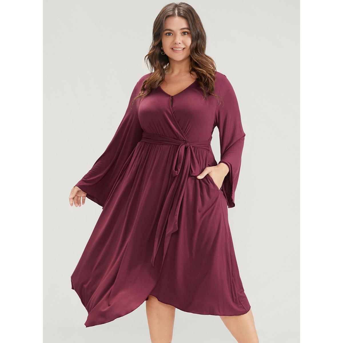 Plus Size Solid Wrap Knotted Front Pocket Bell Sleeve Asymmetrical Hem Dress Burgundy Women Elegant Wrap V-neck Long Sleeve Curvy Midi Dress BloomChic 14-16/1X Product Image