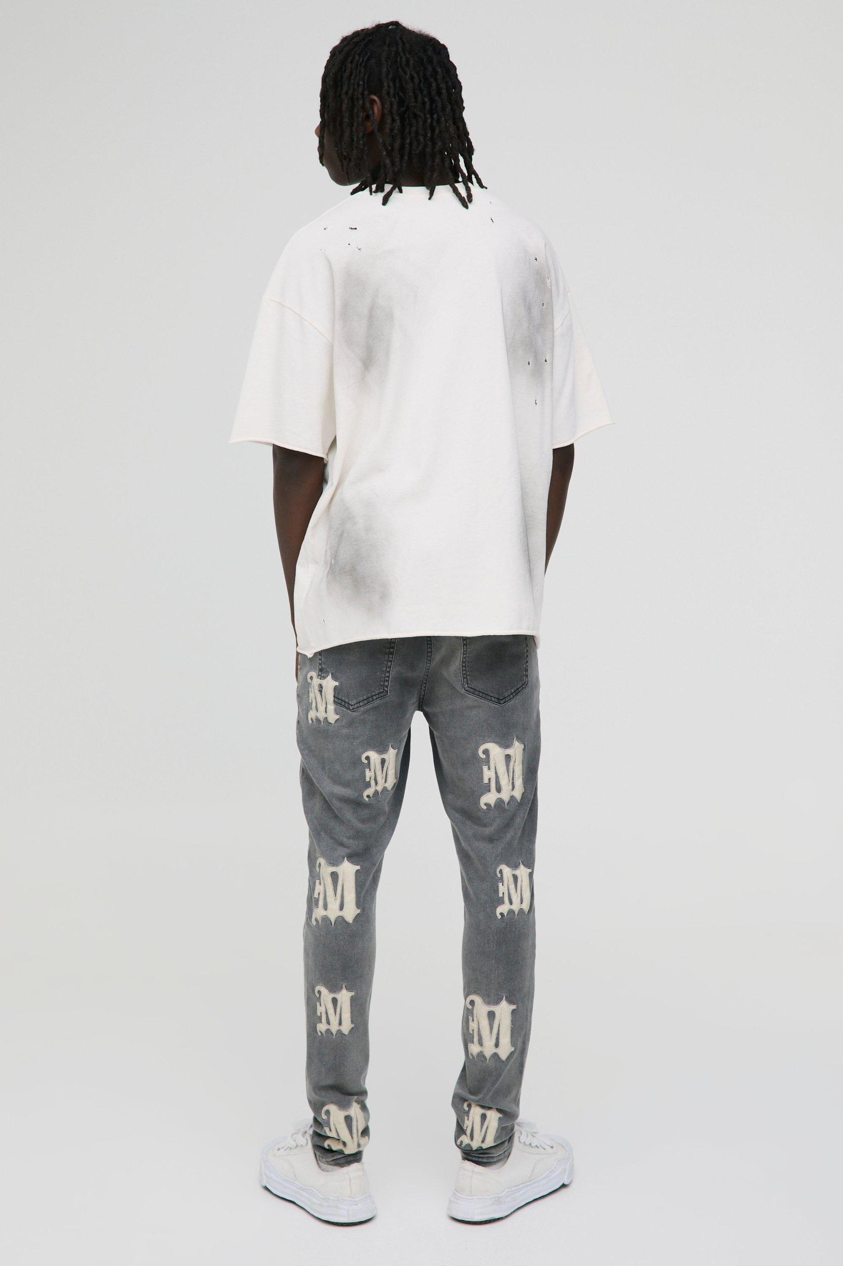 Skinny PU Applique Washed Denim Jeans | boohooMAN USA Product Image