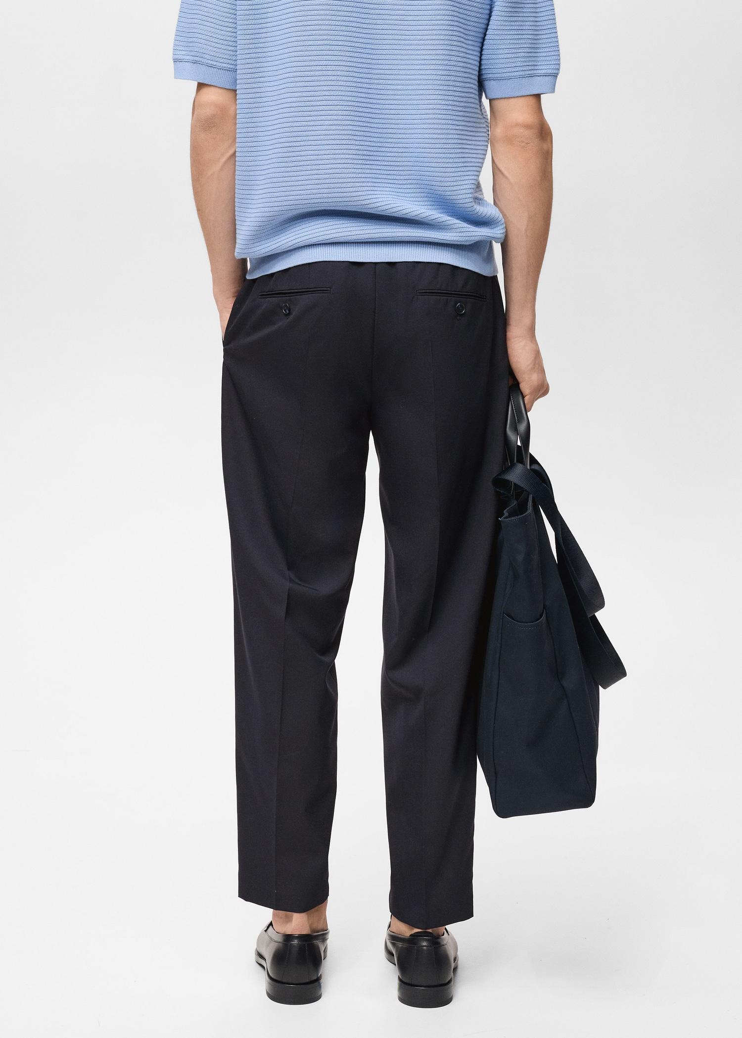Slim-fit pleated cool wool pants - Men | MANGO USA Product Image