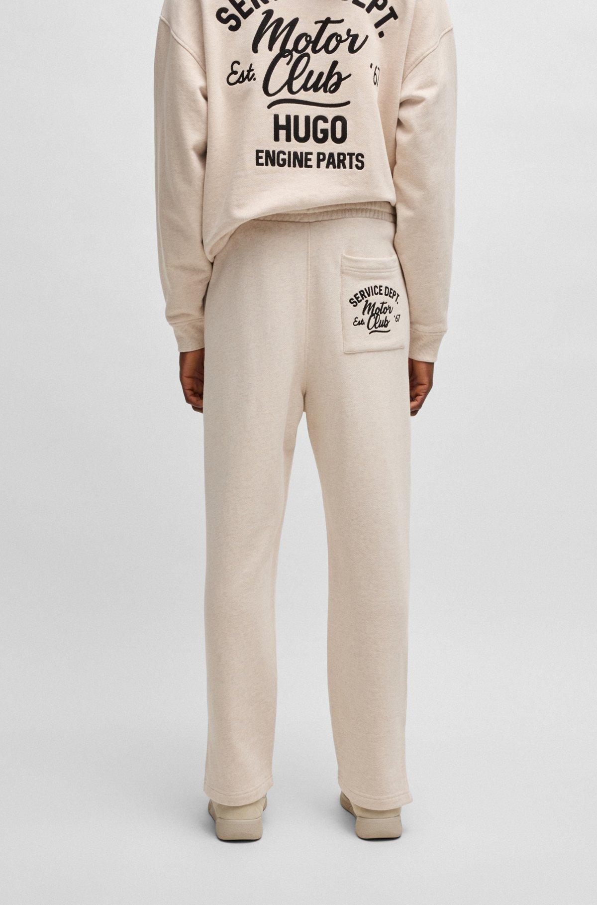 Cotton-terry tracksuit bottoms with embroidered graphics Product Image