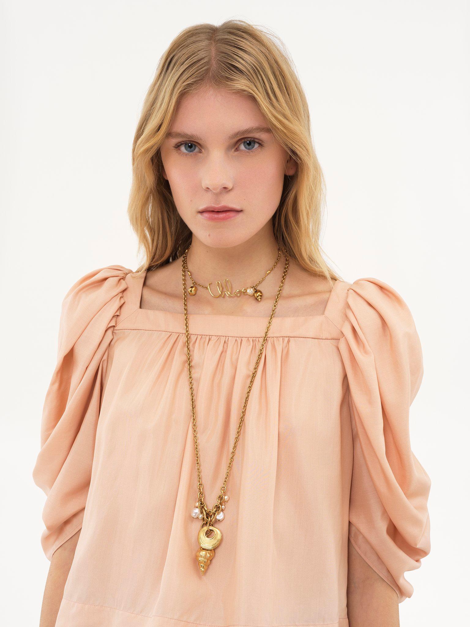 Puff-sleeve pleated top in silk poplin Product Image
