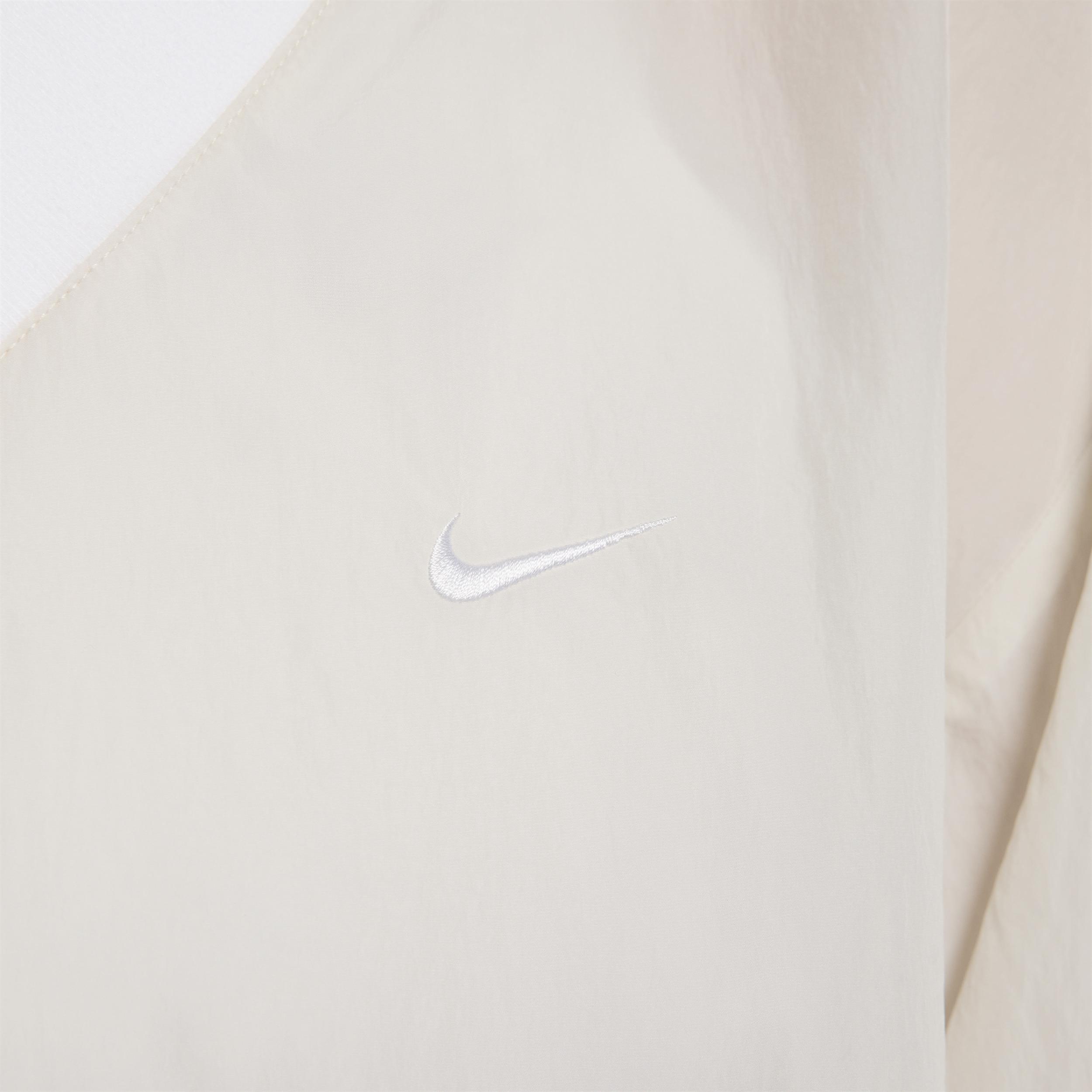 Womens Nike Sportswear Essential Loose UV Woven Long-Sleeve V-Neck Top | FV7649-110 Product Image