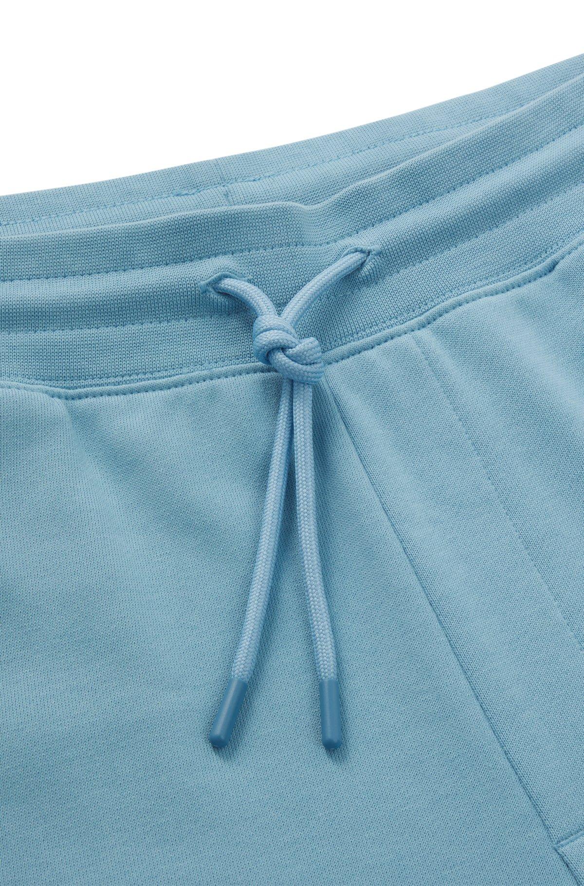 Cotton-terry tracksuit bottoms with Happy HUGO logo Product Image