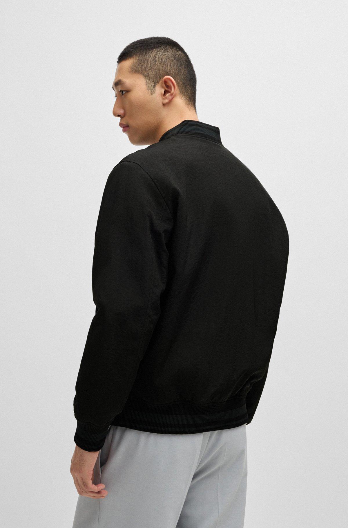 Water-repellent bomber jacket with rubberized logo Product Image