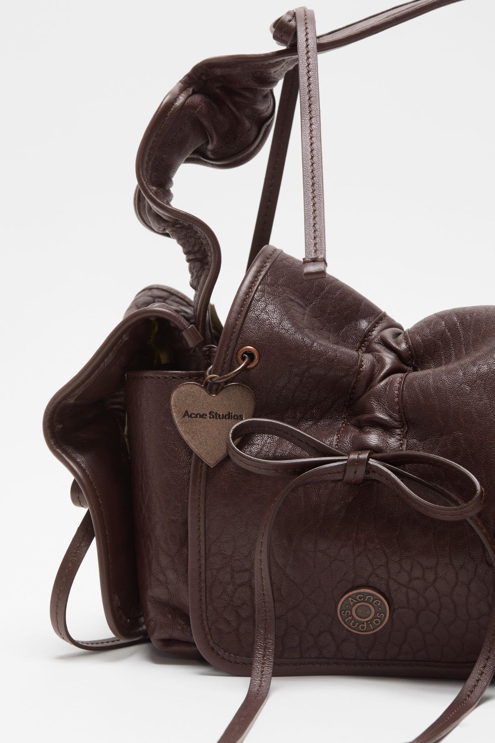 Multipocket grained leather bag Product Image