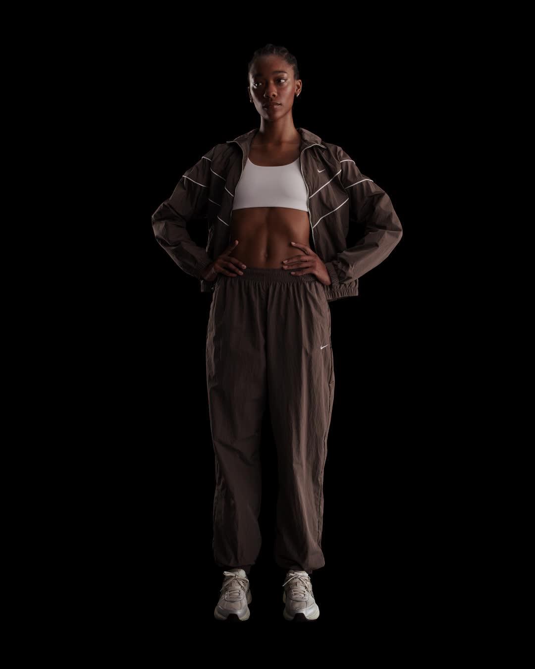 Womens Nike Sportswear Essential Mid-Rise Oversized Woven Jogger Pants | FV7668-004 Product Image