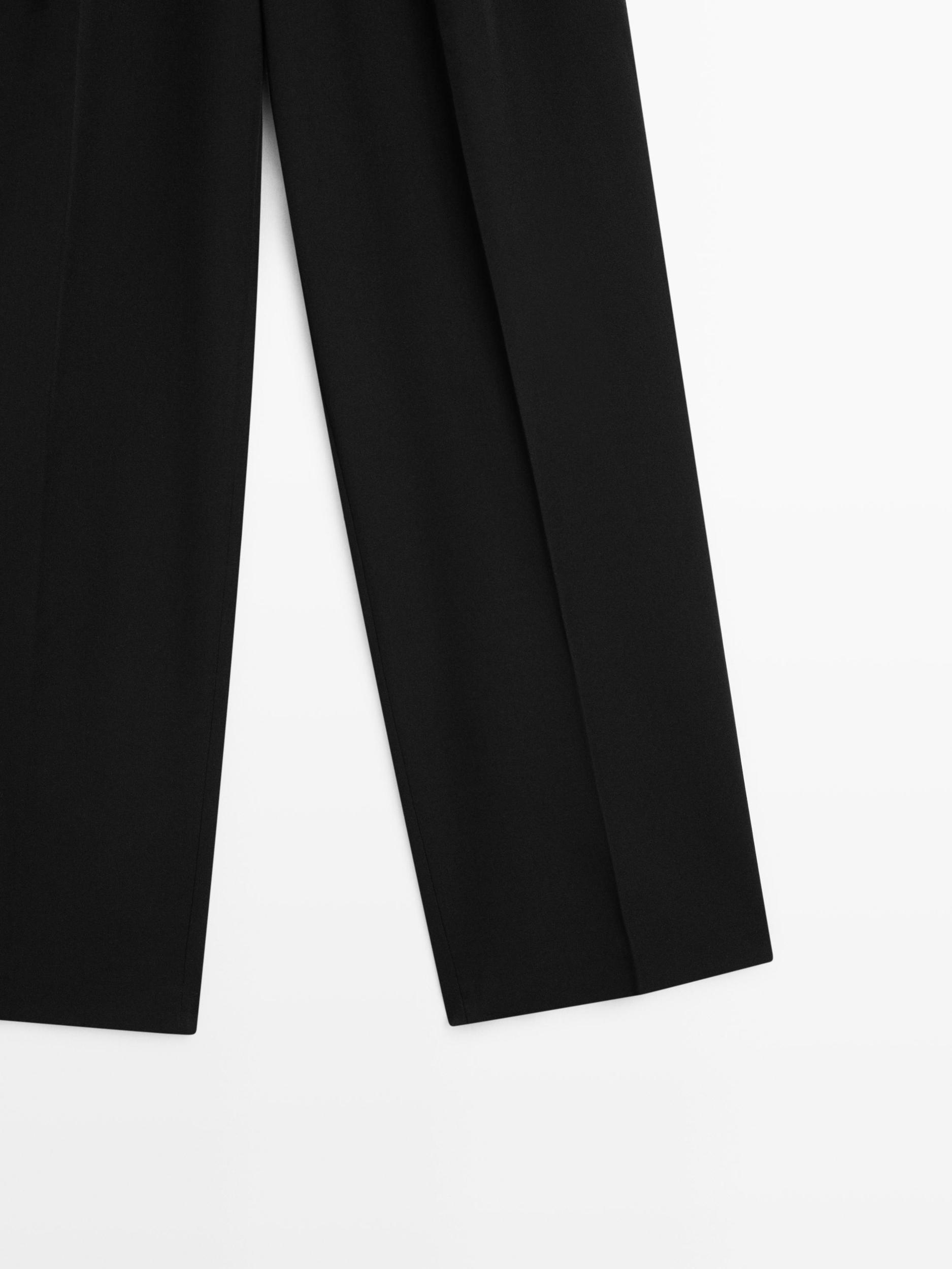 Wide-leg flowing trousers with darts Product Image