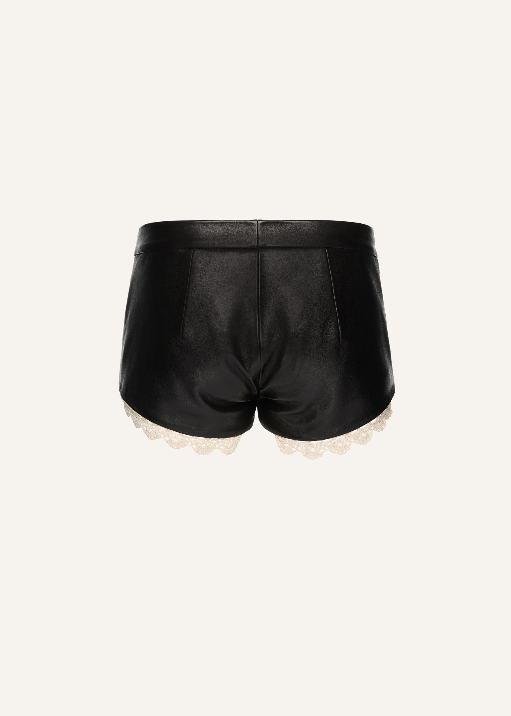 Lace trim leather shorts in black Product Image