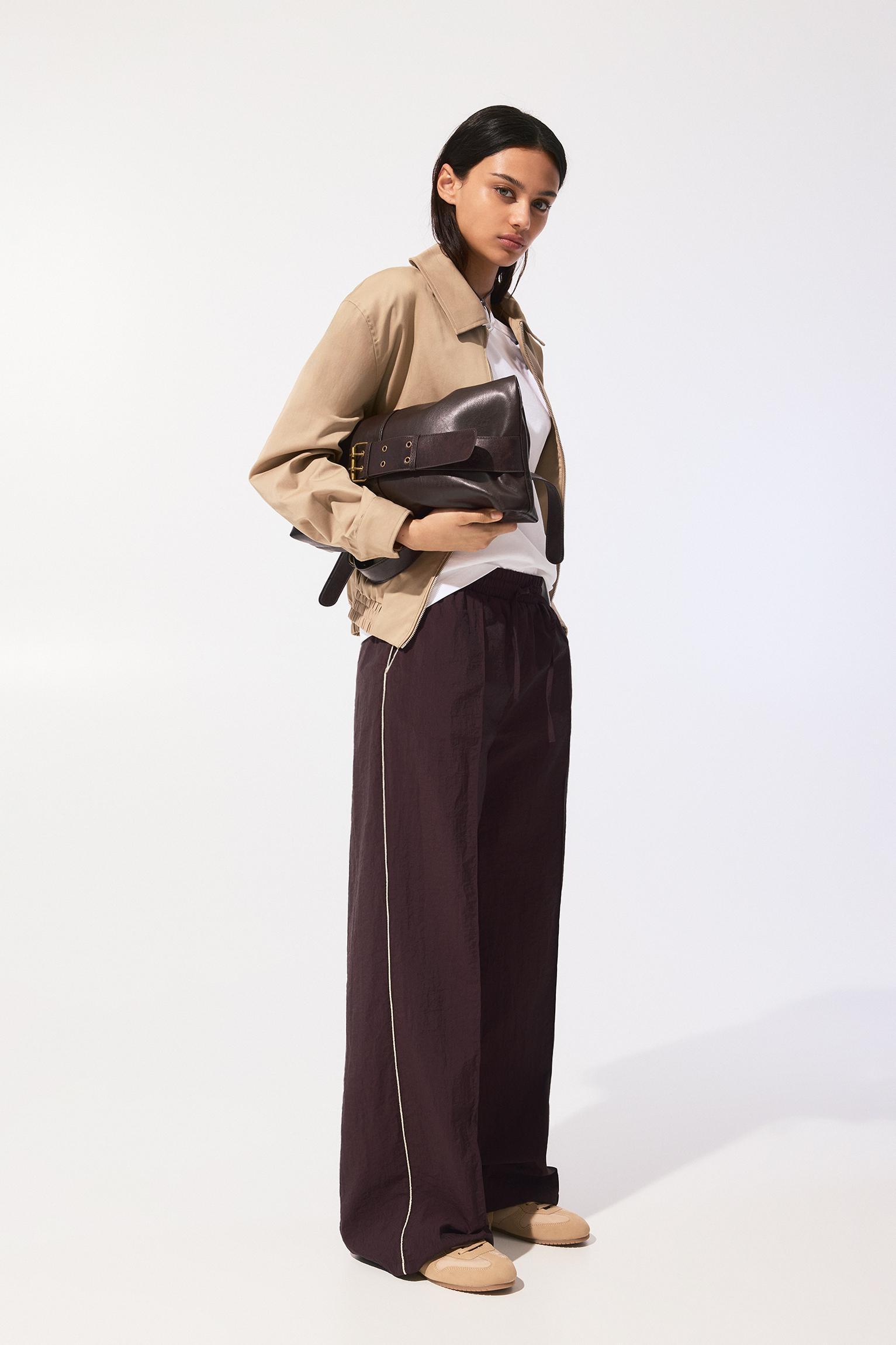 Tracksuit pants with side stripes Product Image