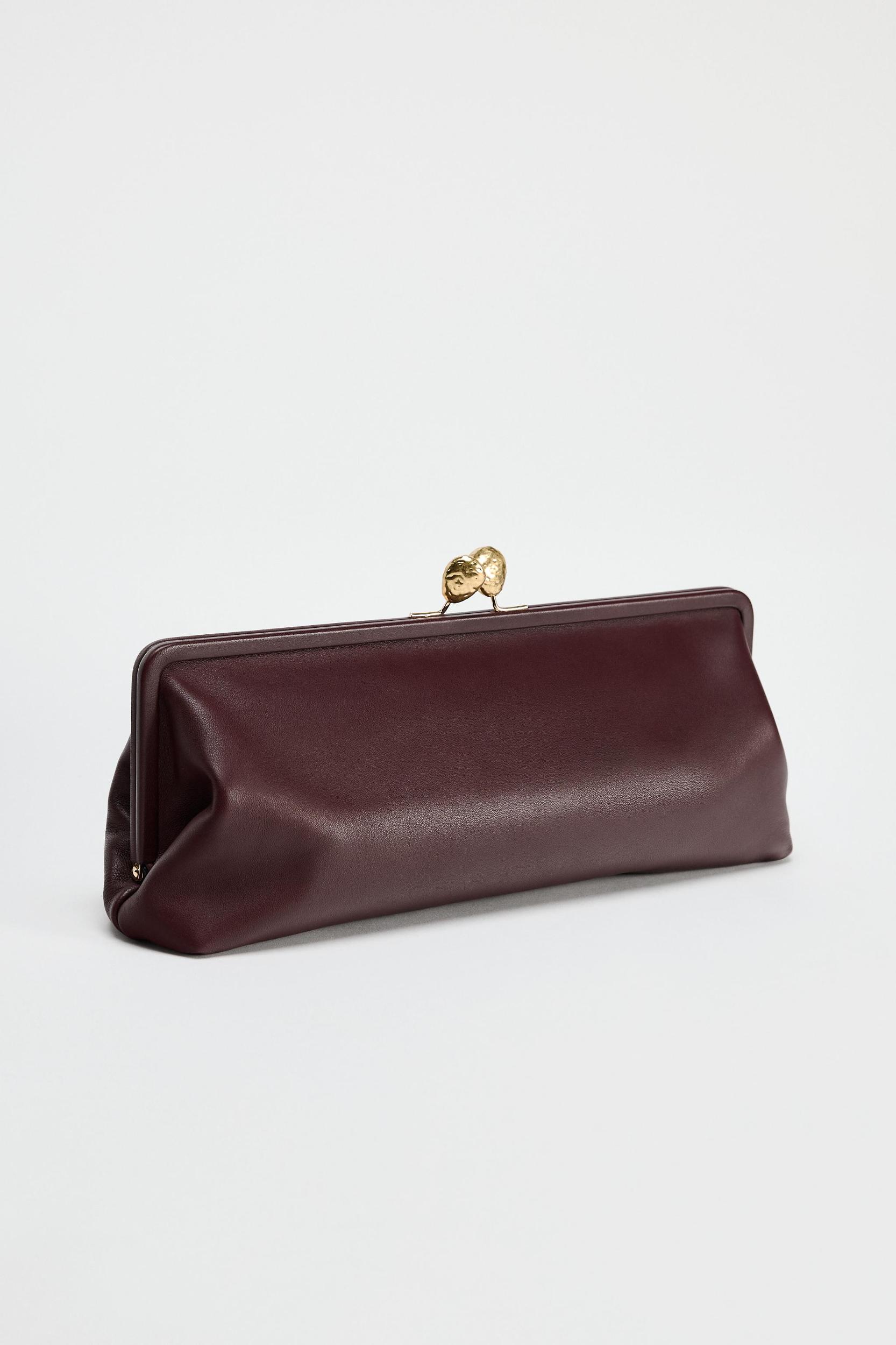 METAL TRIM LEATHER CLUTCH Product Image