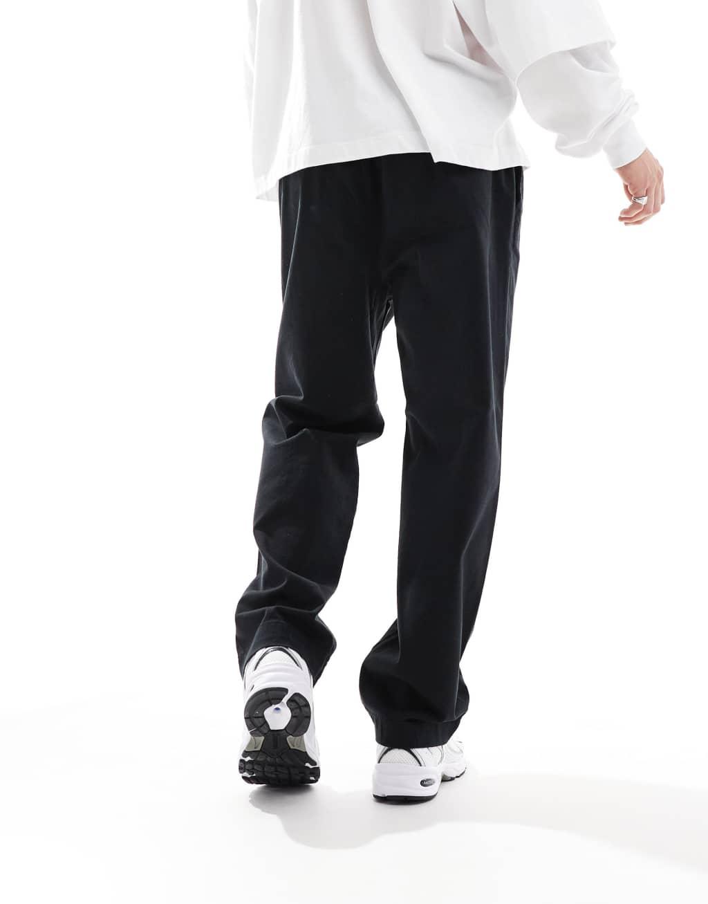 Jack & Jones loose fit pull-on chinos with pleated front in black Product Image