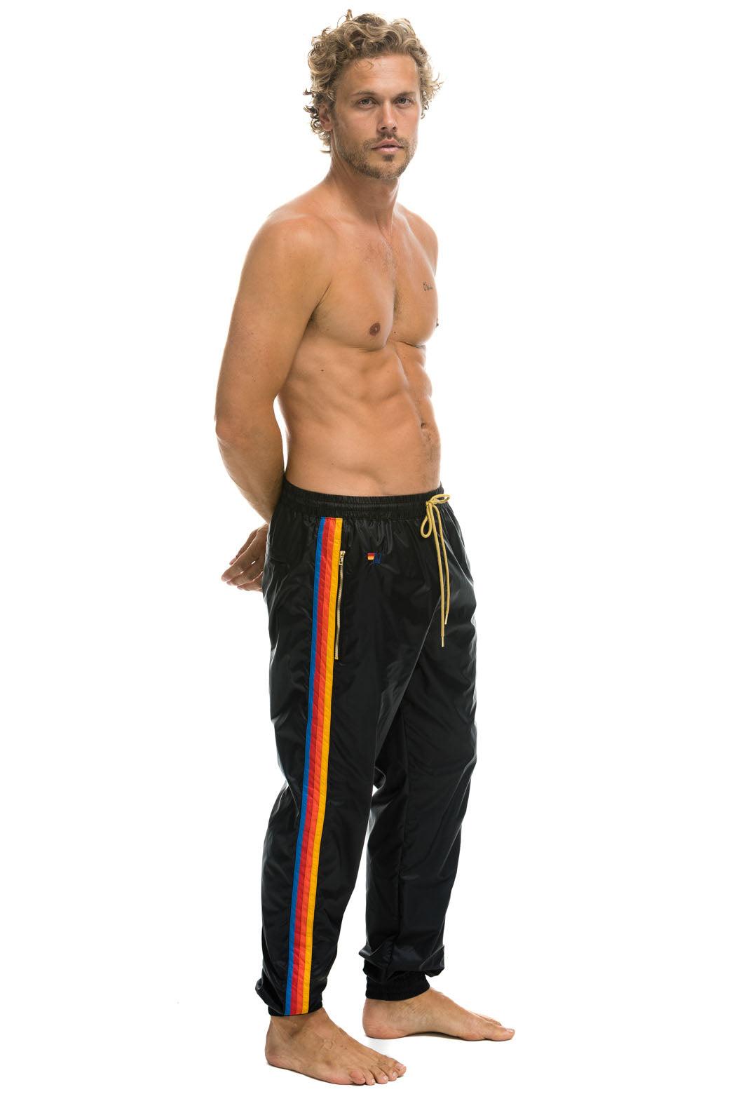 MEN'S 4 STRIPE WIND PANT - BLACK Male Product Image