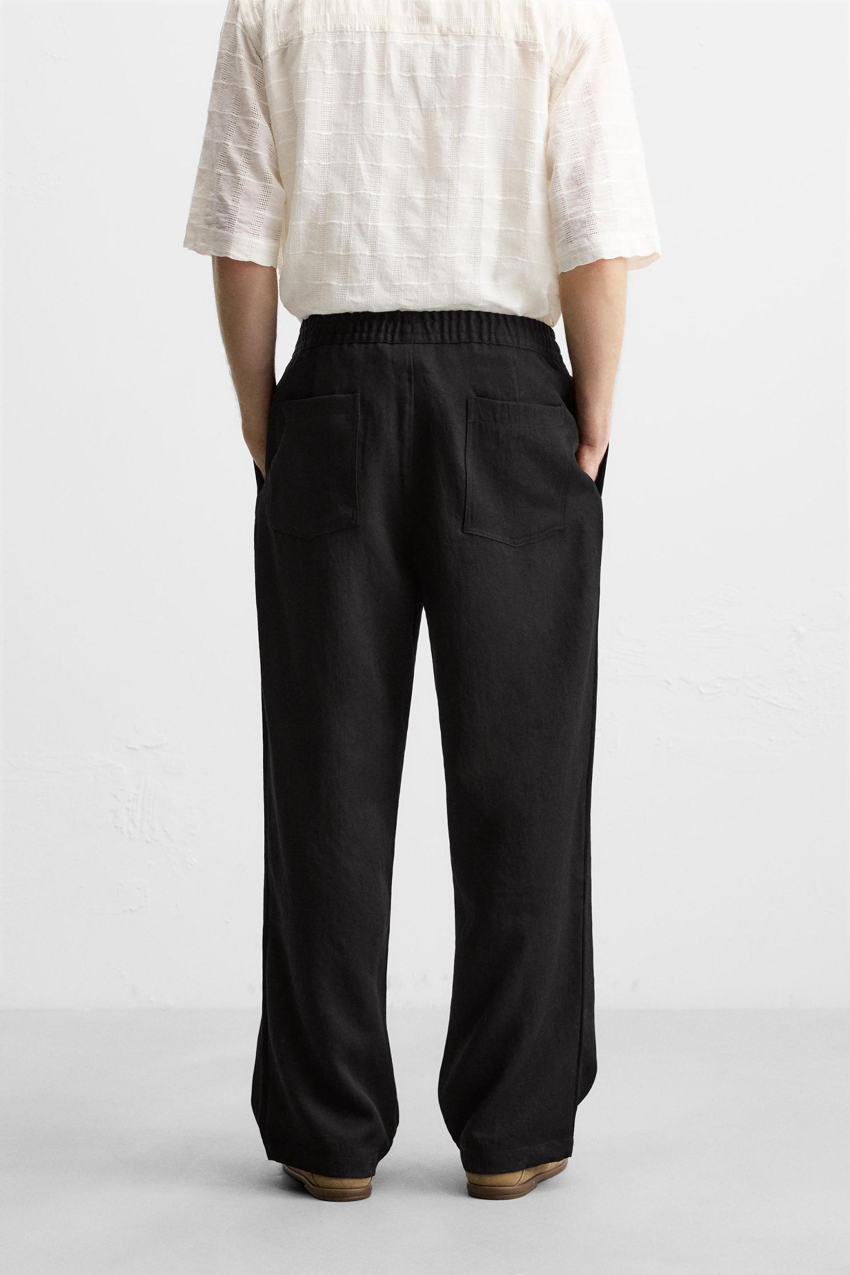 FLOWY PLEATED PANTS Product Image