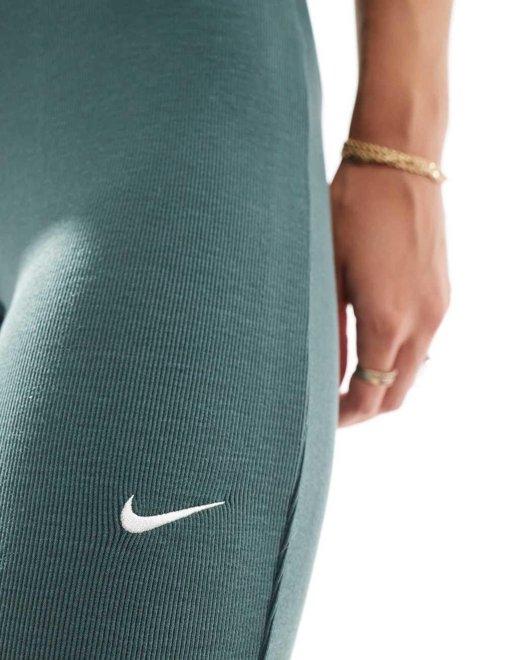 Nike Chill ribbed mid rise flared leggings in dark green Product Image