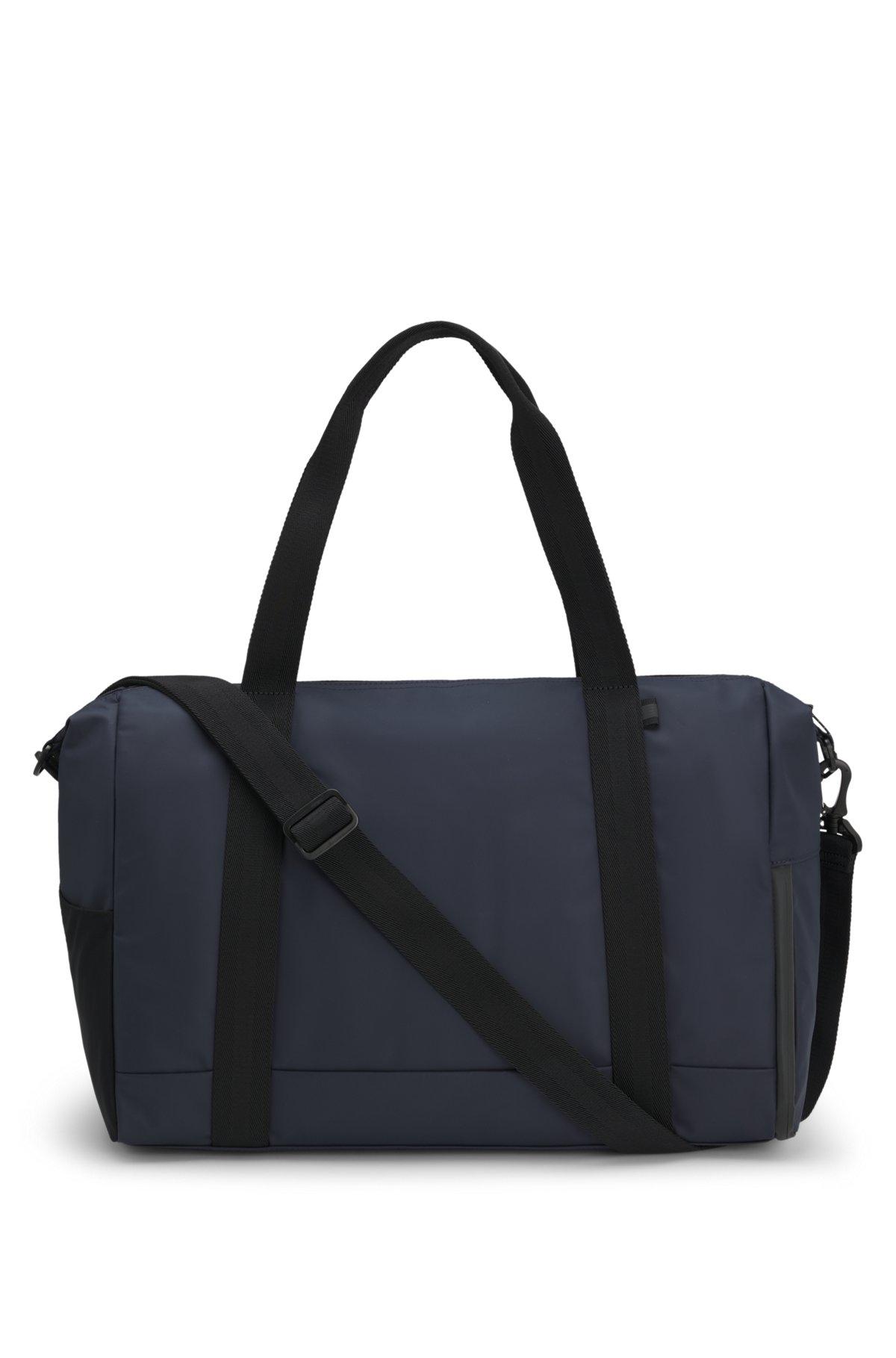 Reflective-detail holdall in faux leather Product Image